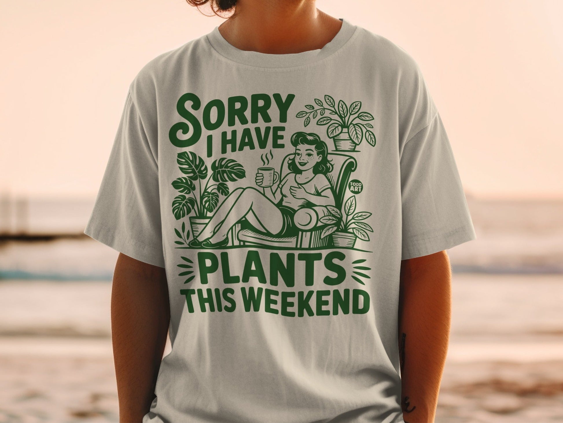 Green t-shirt with "Sorry I Have Plants This Weekend" and plant illustrations.