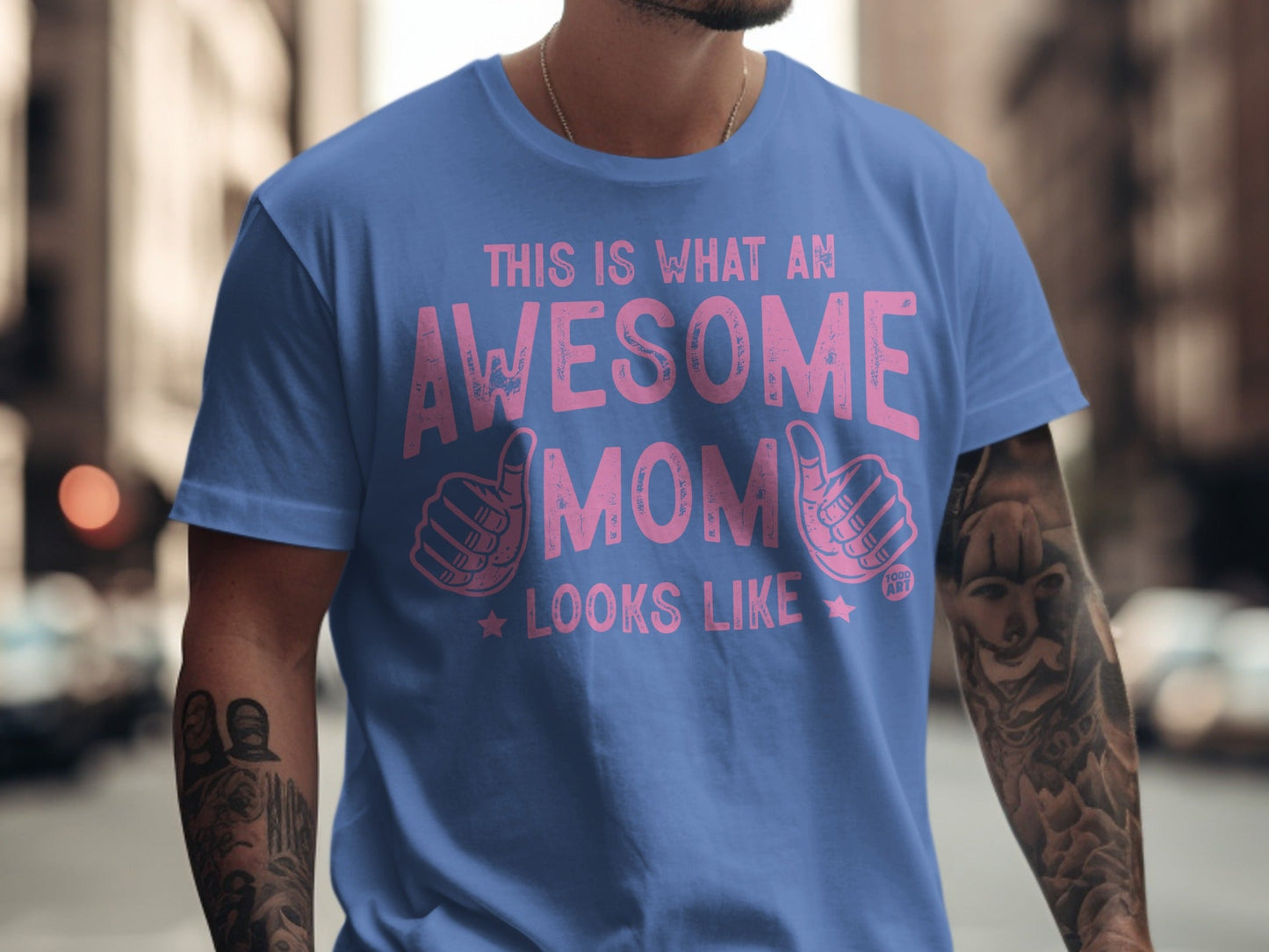 Blue t-shirt with pink text: "This is what an awesome mom looks like".