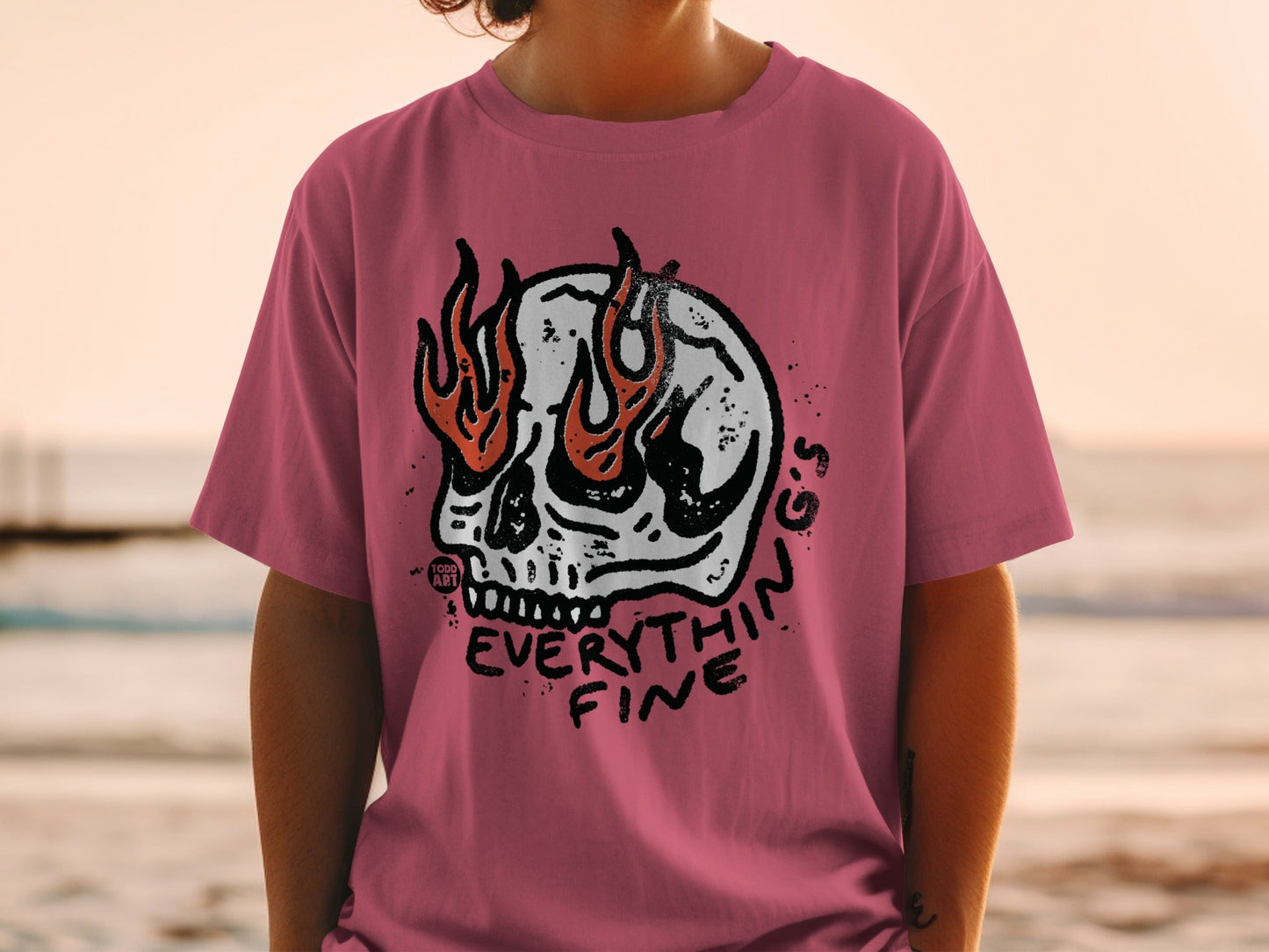 Pink t-shirt with a flaming skull graphic and "Everything Fine" text.