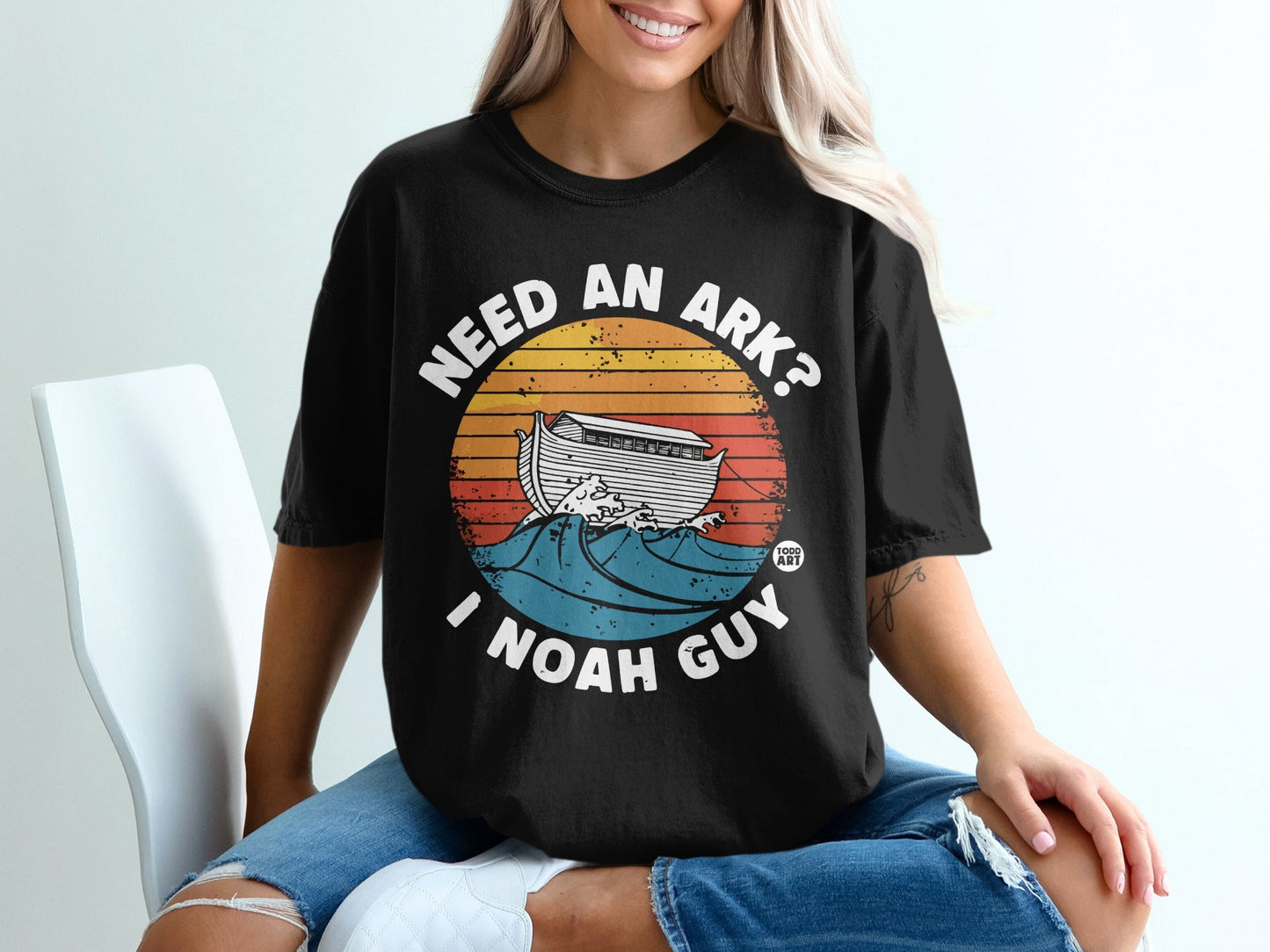 Black t-shirt with "Need an Ark? I Noah Guy" and Noah's ark on waves.