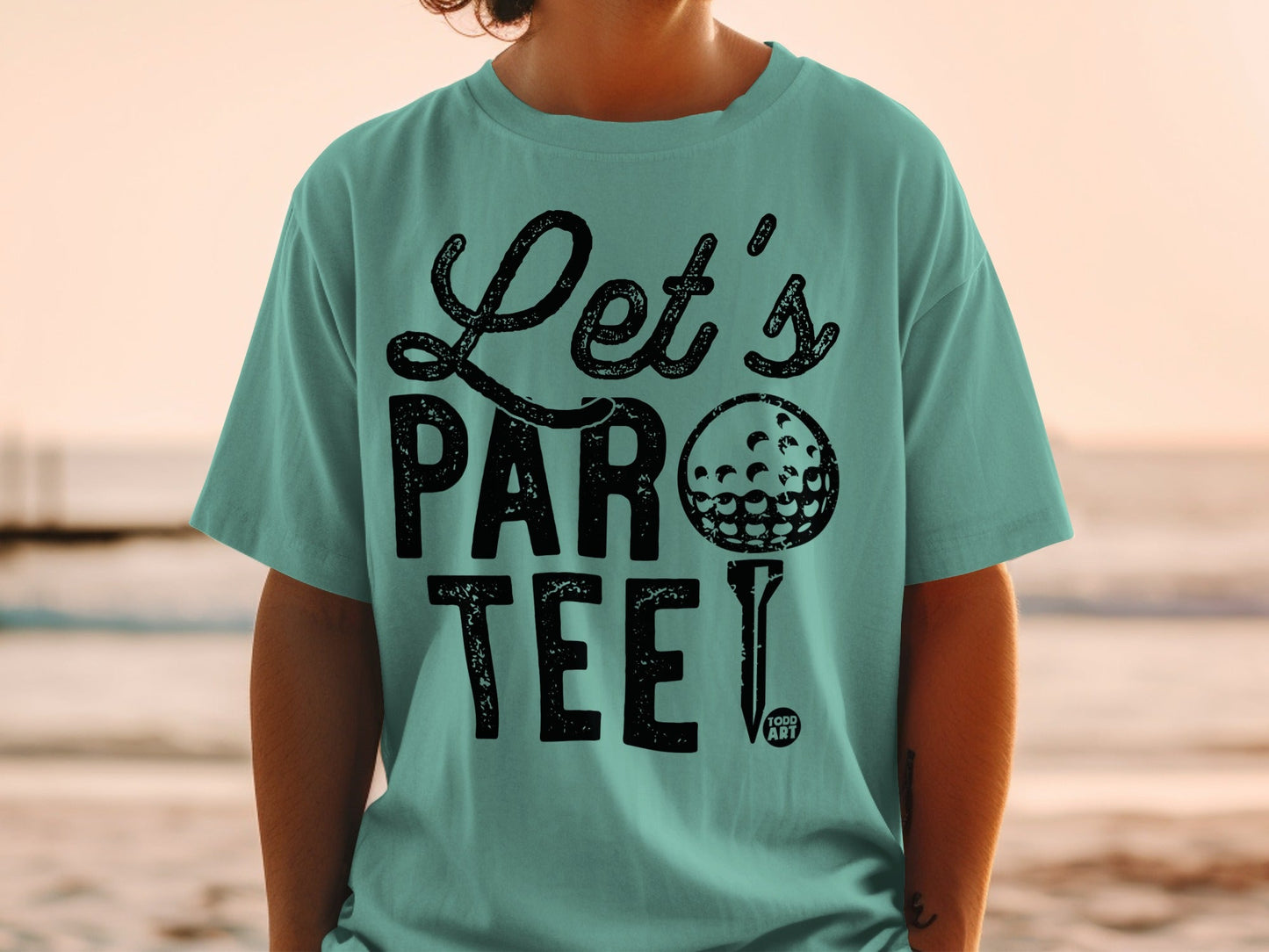 Teal t-shirt with "Let's PAR TEE!" text and golf ball graphic.
