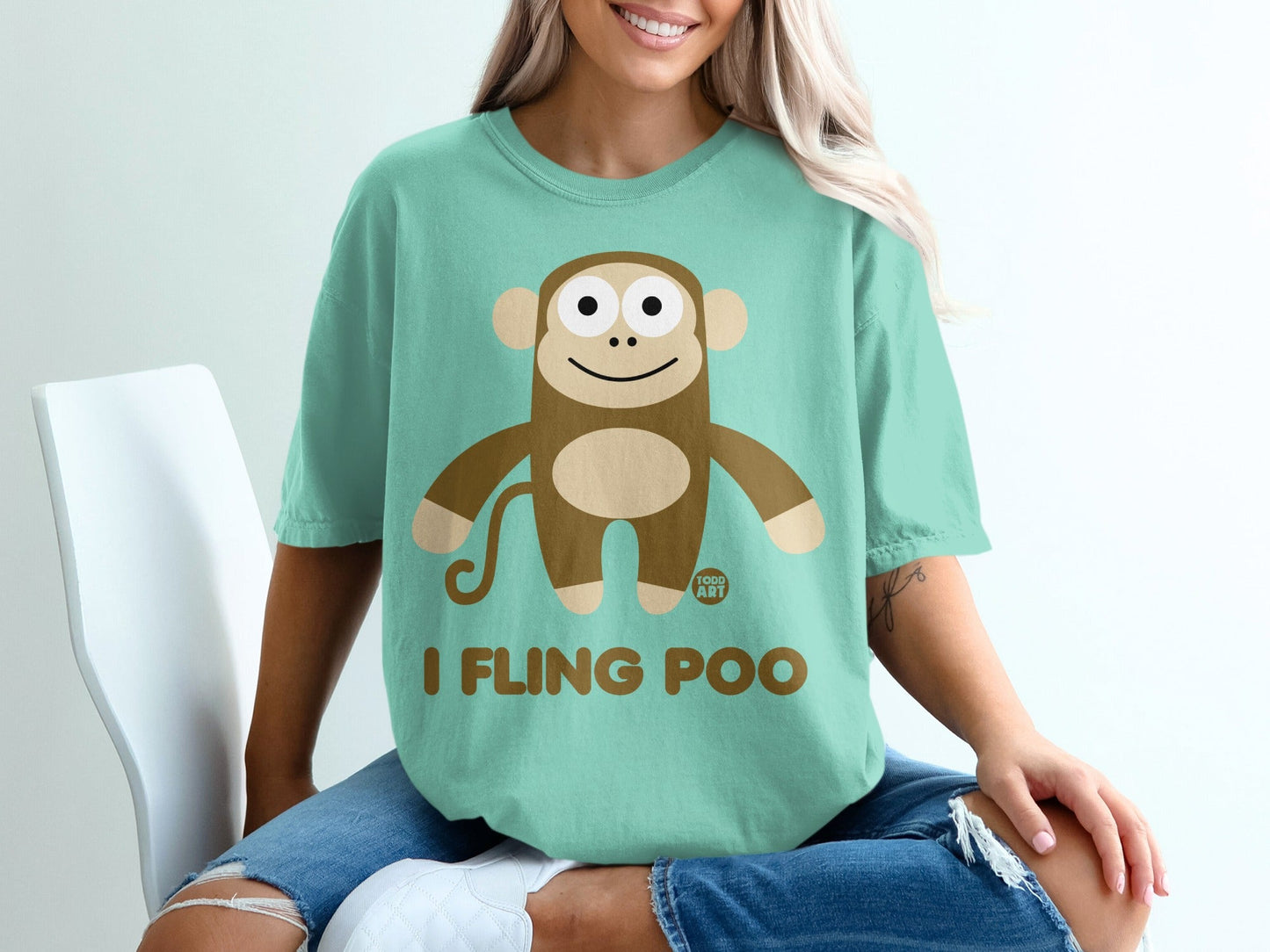 Teal t-shirt with a cartoon monkey graphic and text "I FLING POO".