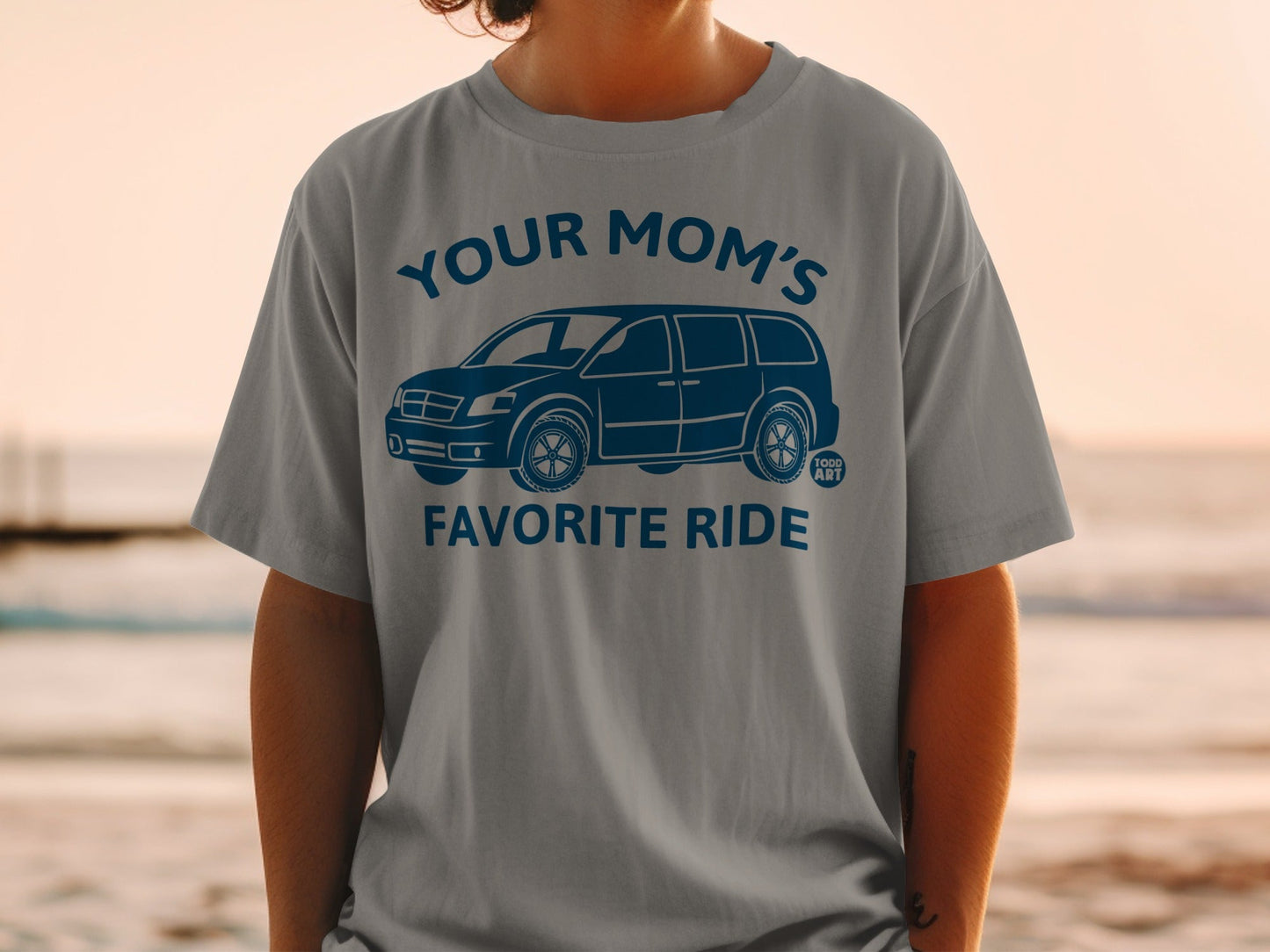 Gray t-shirt with "YOUR MOM'S FAVORITE RIDE" and minivan graphic in blue.