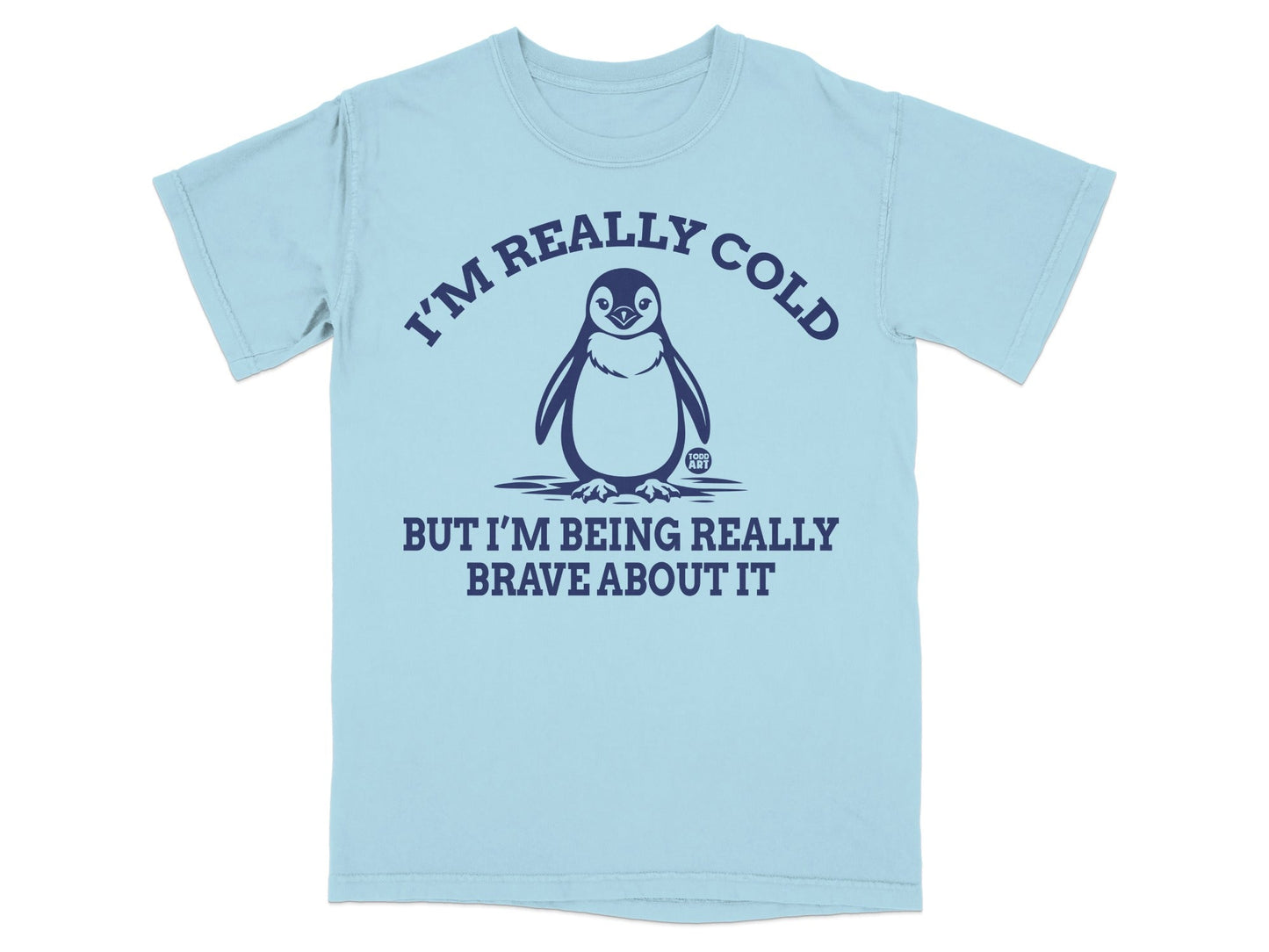 Light blue t-shirt with a penguin and text "I'M REALLY COLD BUT I'M BEING REALLY BRAVE ABOUT IT".