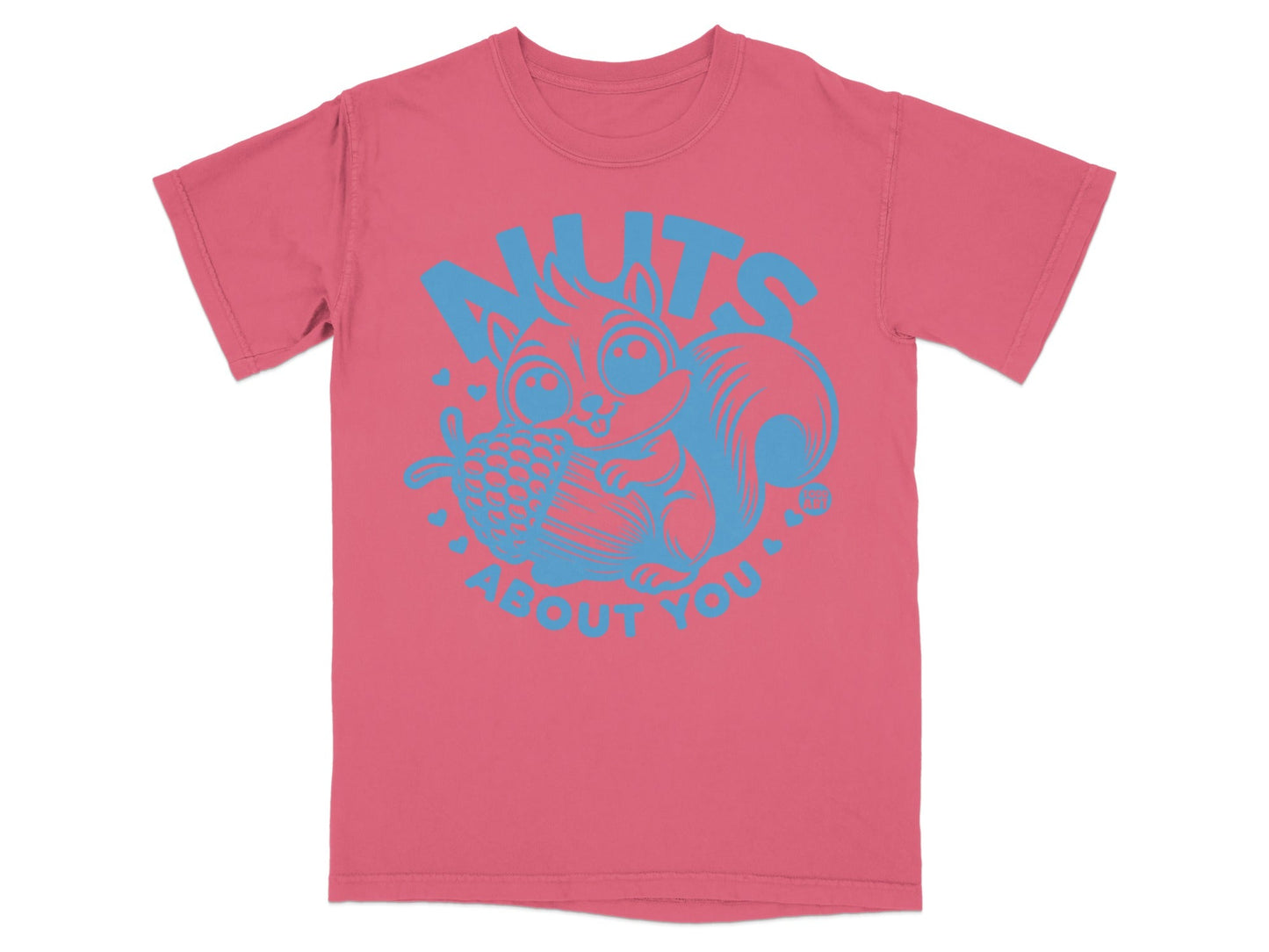 Pink t-shirt with blue "Nuts About You" squirrel graphic.