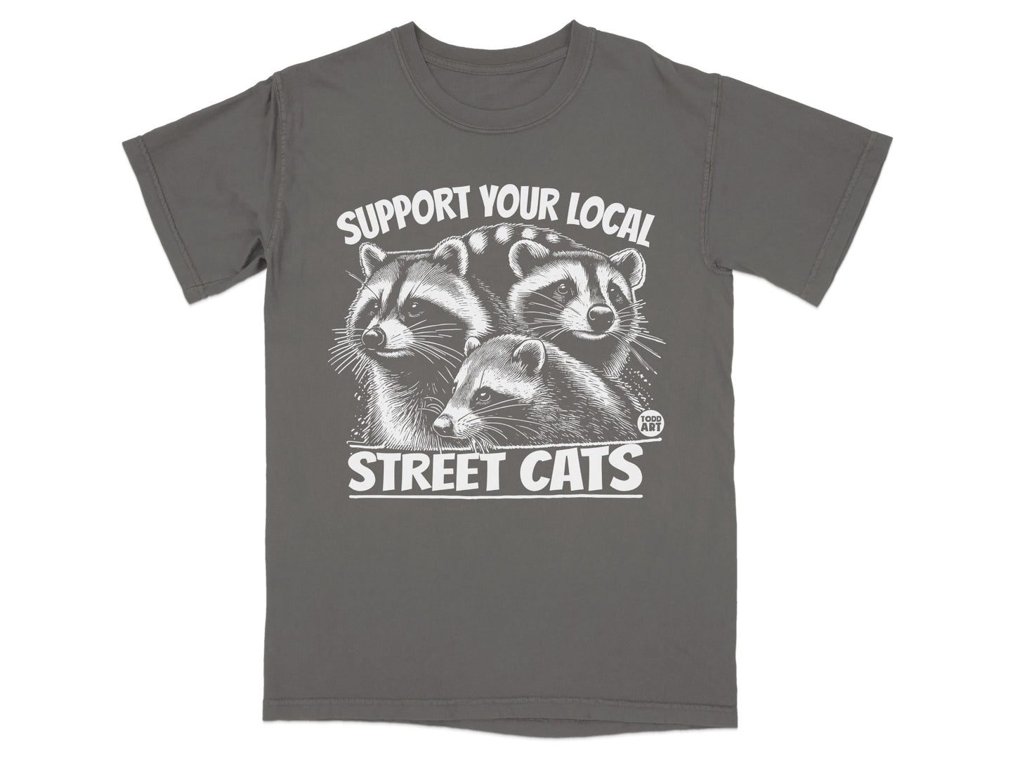 T-shirt graphic with three raccoons and "SUPPORT YOUR LOCAL STREET CATS" text.