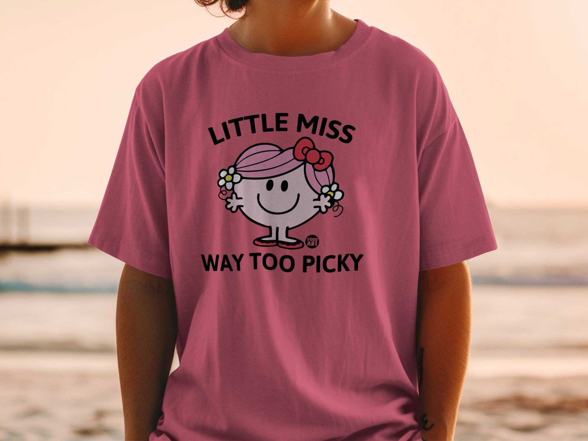 Pink t-shirt with "Little Miss Way Too Picky" graphic and bow.