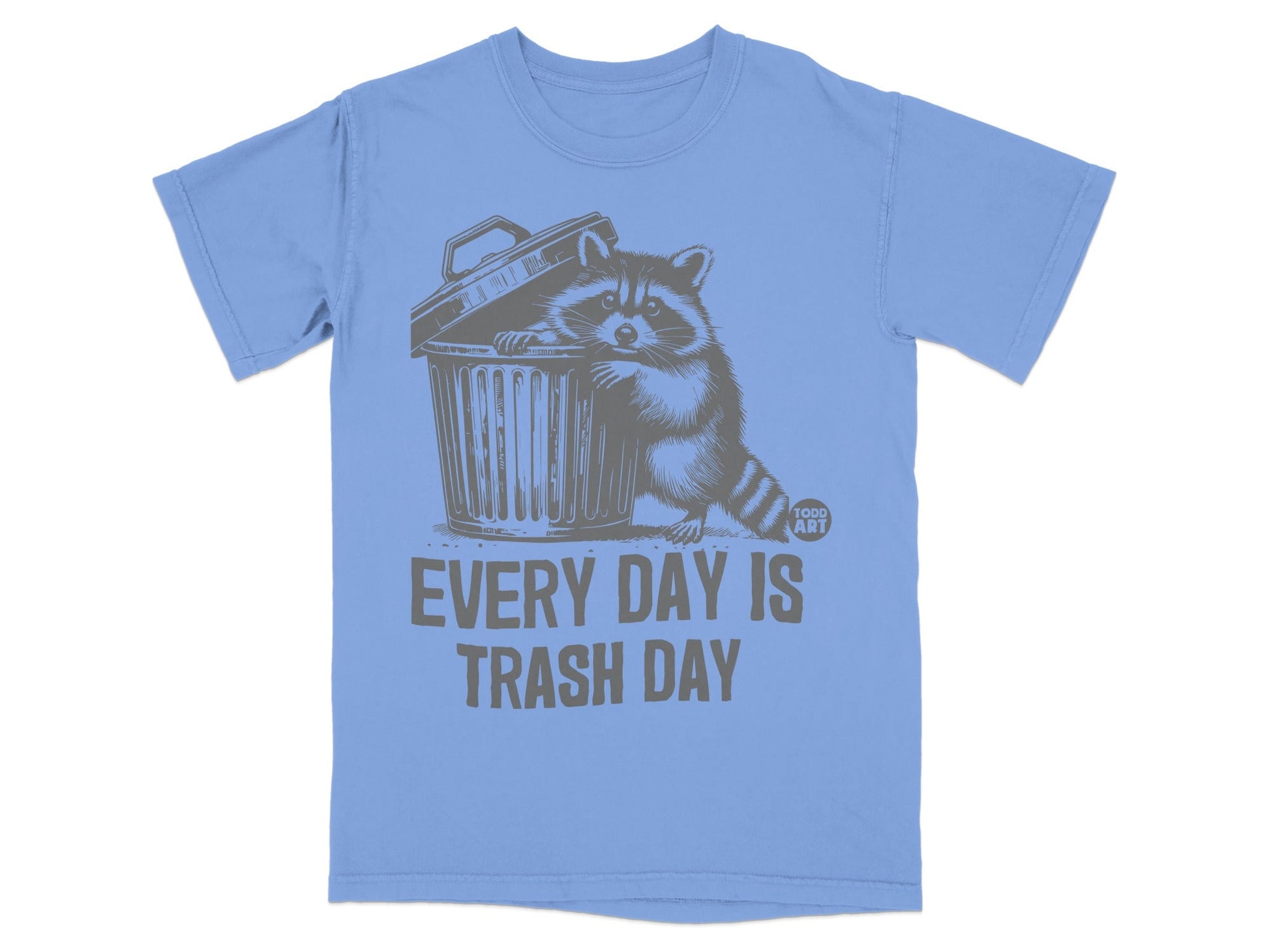 T-shirt with raccoon peeking out of trash can, text "EVERY DAY IS TRASH DAY".