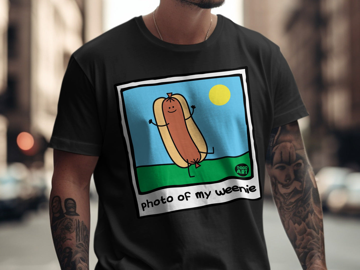 T-shirt with illustration of a happy hot dog on a sunny day.