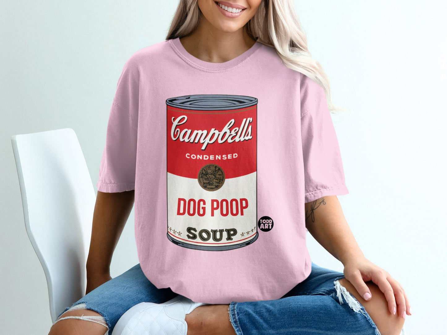 Pink t-shirt with Campbell's Dog Poop Soup can graphic.