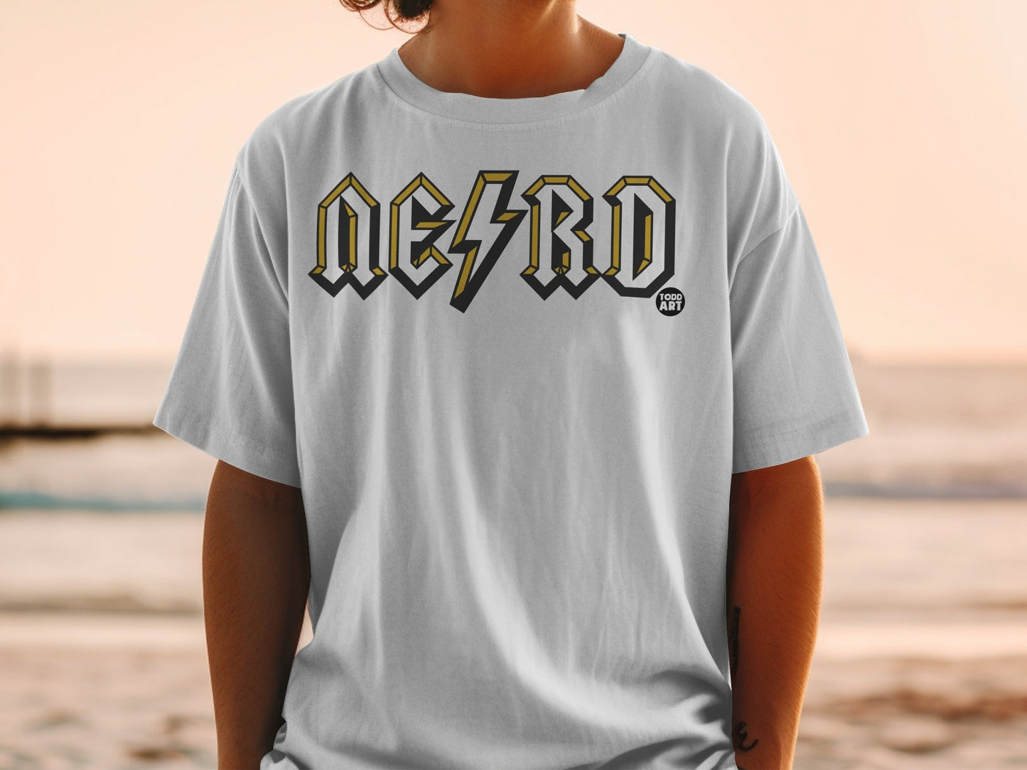 White t-shirt with yellow and black "NERD" lightning bolt graphic.