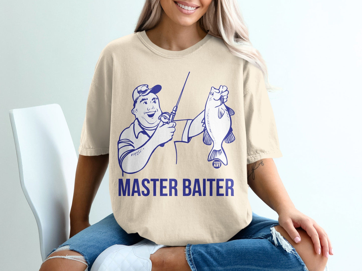 T-shirt with "MASTER BAITER" text and a cartoon fisherman holding a fish.