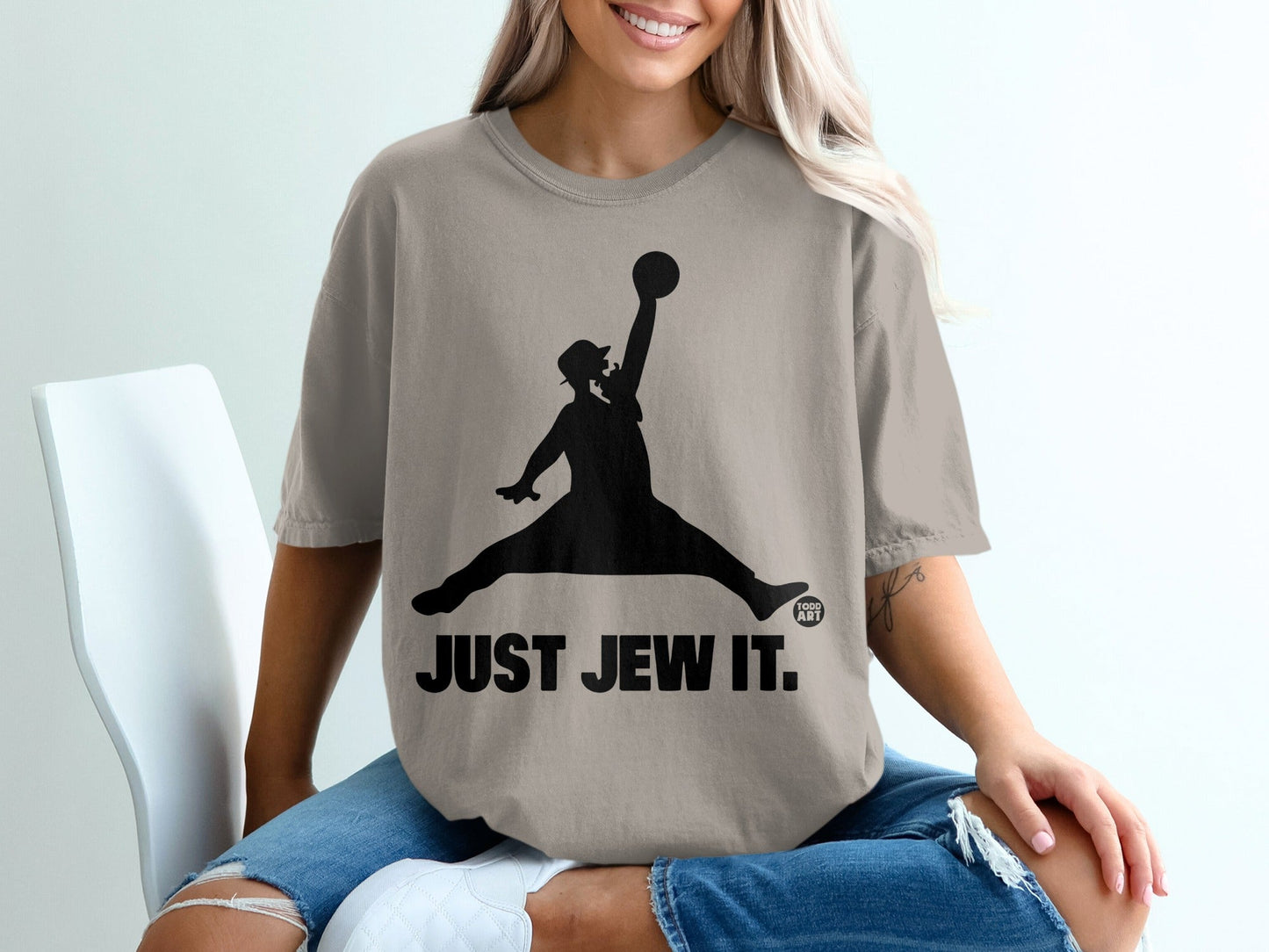 T-shirt with silhouette of a figure in a basketball dunk pose, "JUST JEW IT."