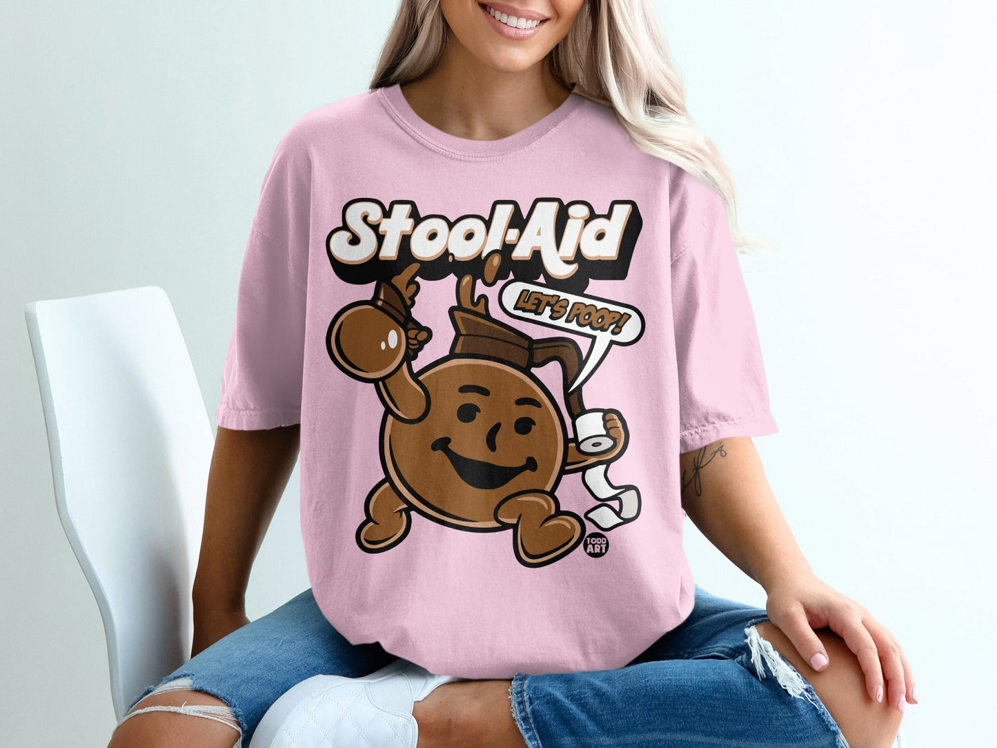 Pink t-shirt with "Stool-Aid Let's Poop!" text and cartoon character.