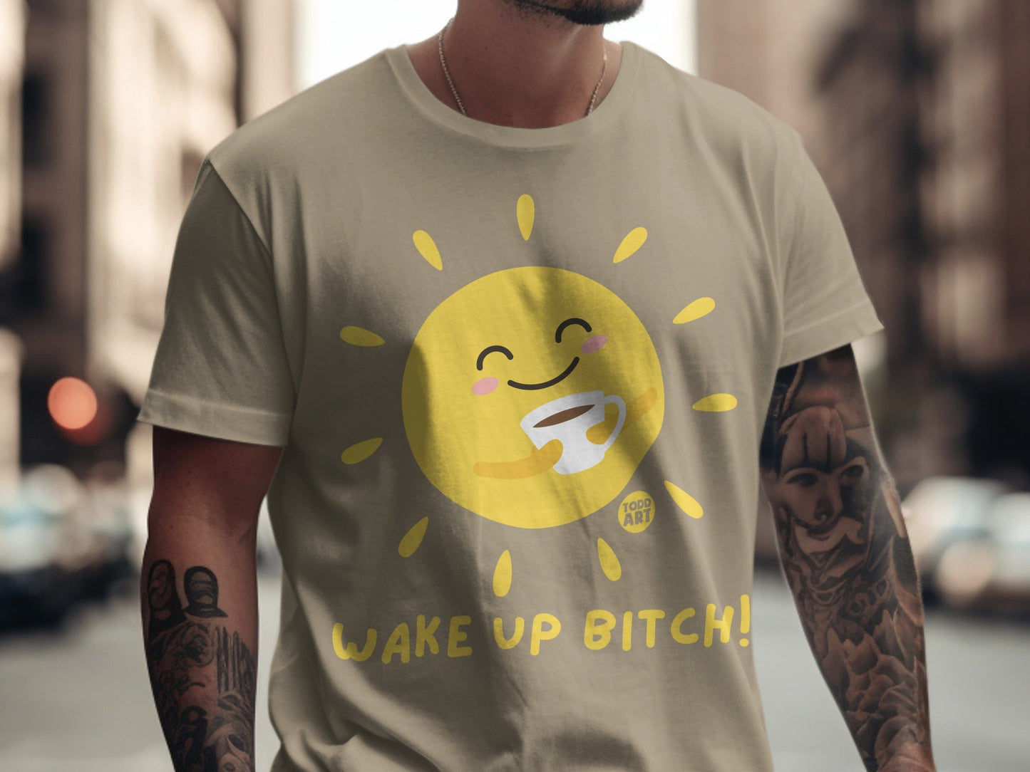 T-shirt with a cartoon sun holding a coffee cup and the text "WAKE UP BITCH!".