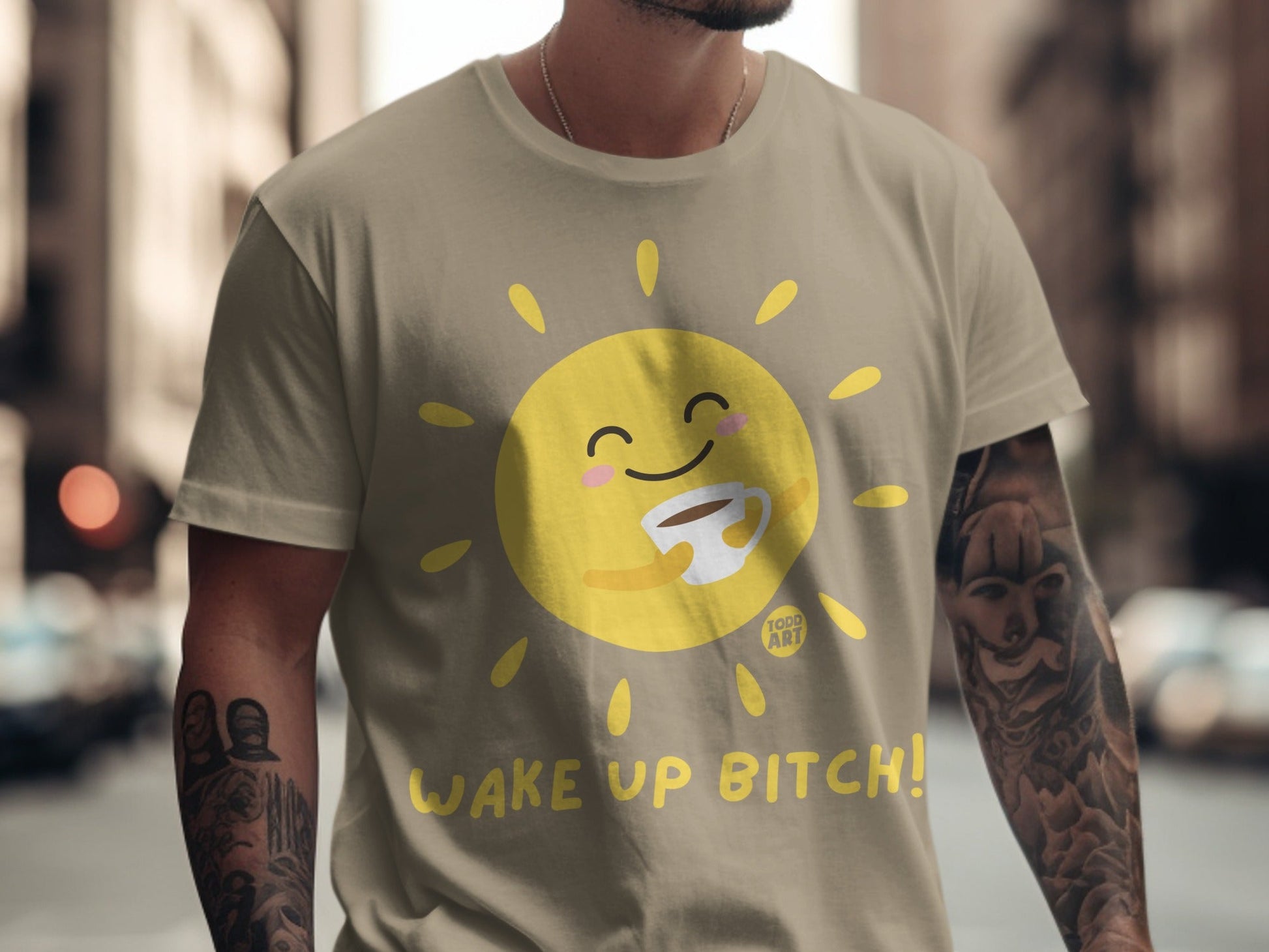 T-shirt with a cartoon sun holding a coffee cup and the text "WAKE UP BITCH!".
