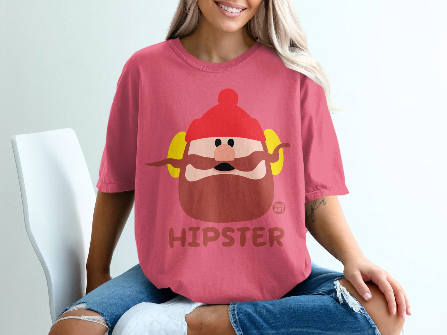 Pink t-shirt with cartoon hipster man graphic and "Hipster" text.