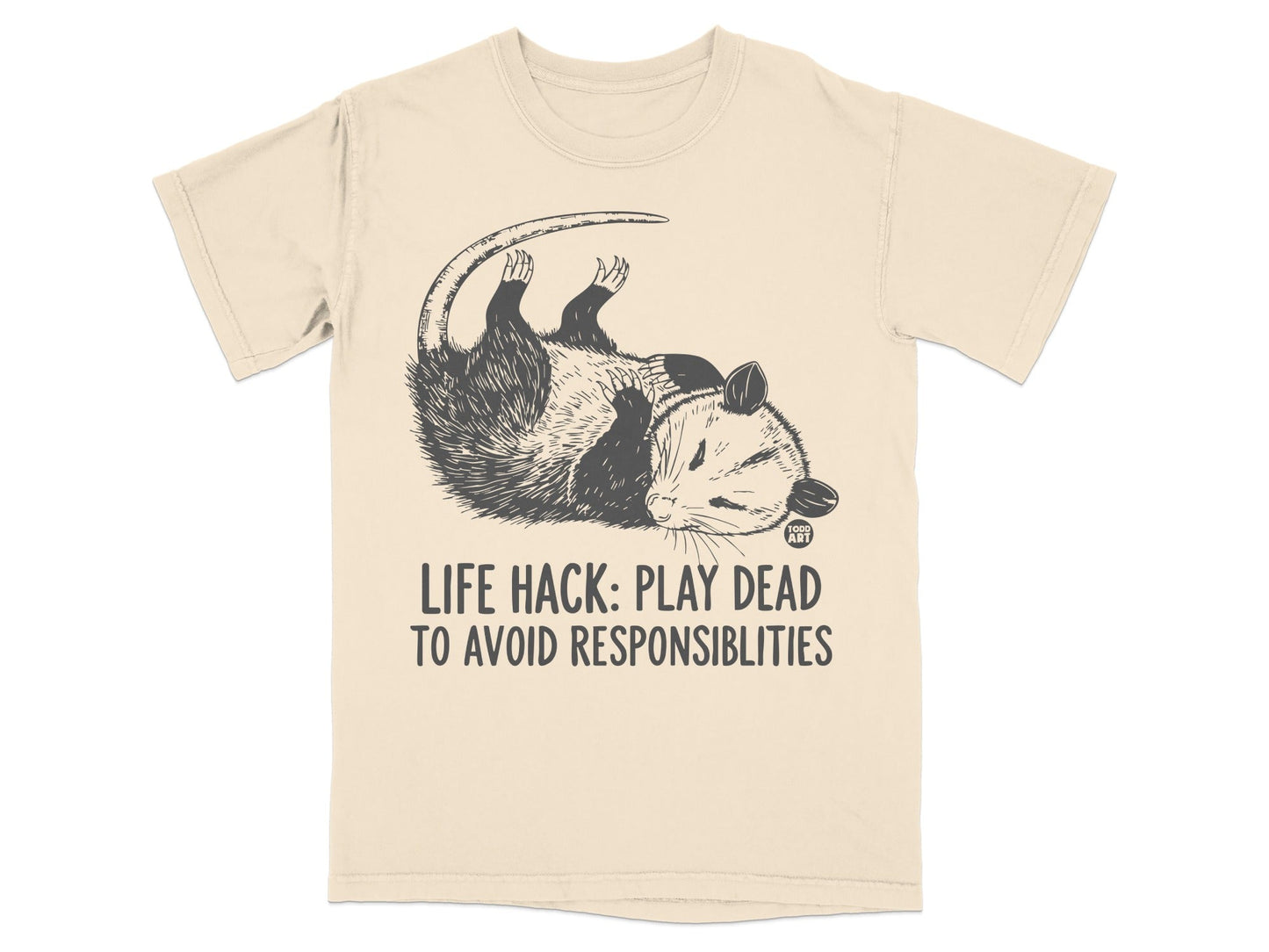 T-shirt with possum playing dead and text "LIFE HACK: PLAY DEAD TO AVOID RESPONSIBILITIES".