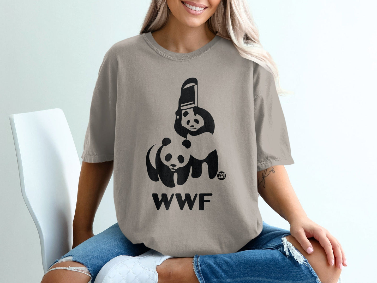Tan t-shirt with black WWF panda logo and text.