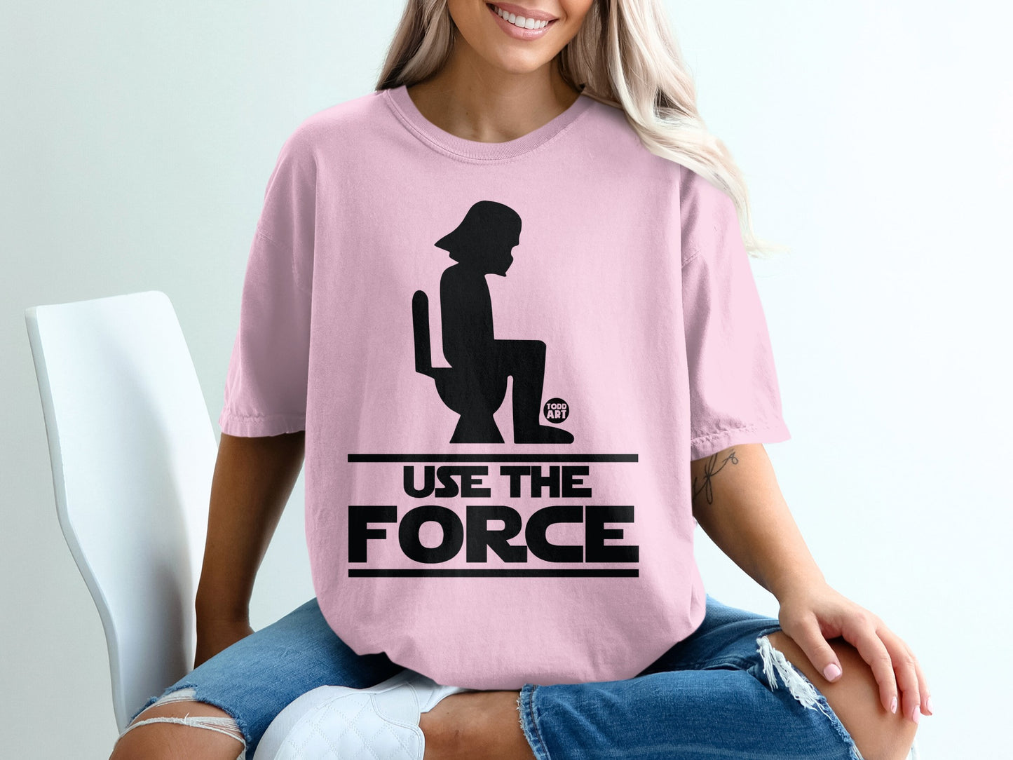 Pink t-shirt with Darth Vader silhouette on toilet, "USE THE FORCE" text.