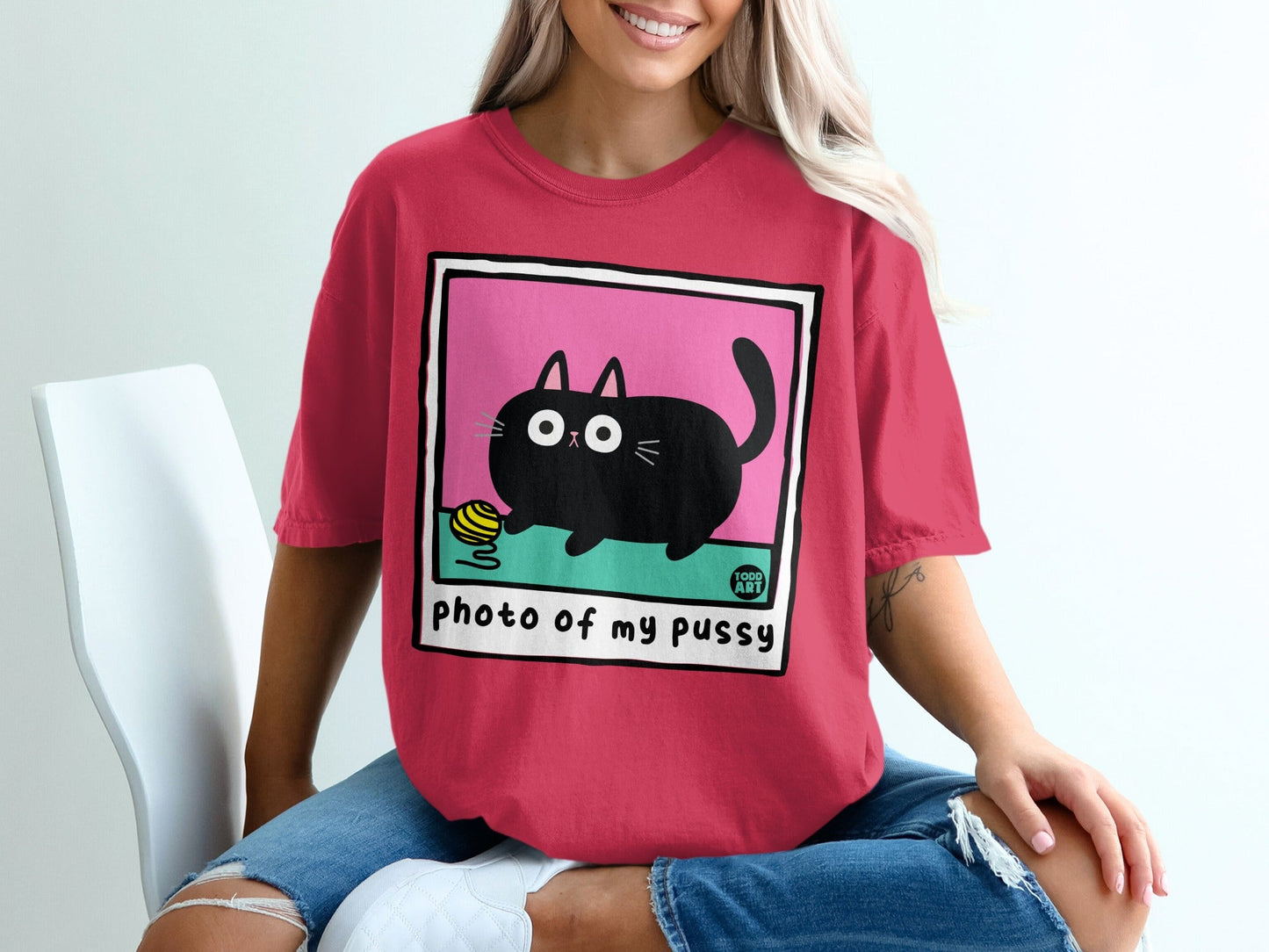 Black cartoon cat with yarn, "photo of my pussy" text.