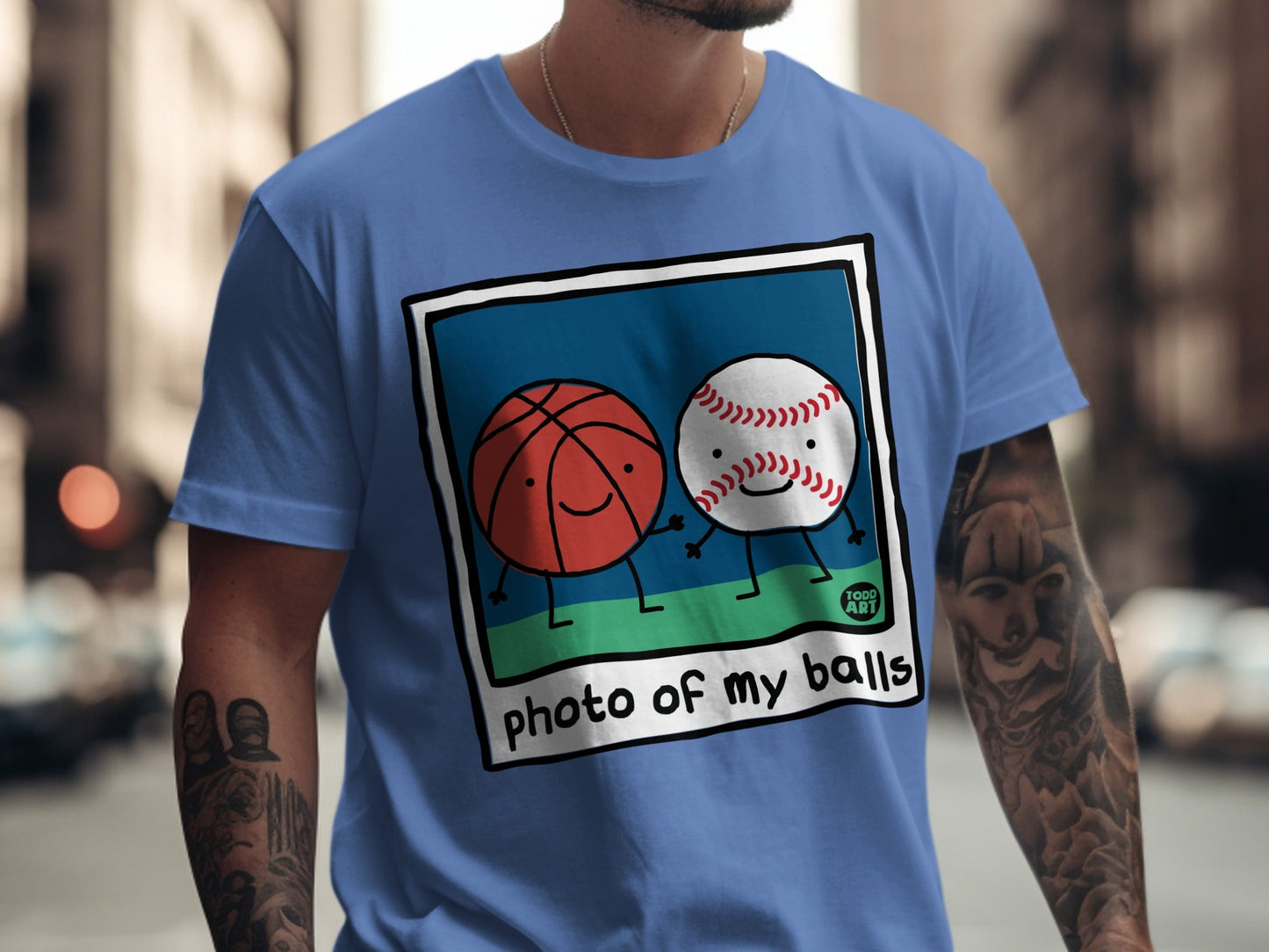 T-shirt with cartoon basketball and baseball holding hands, reading "photo of my balls".