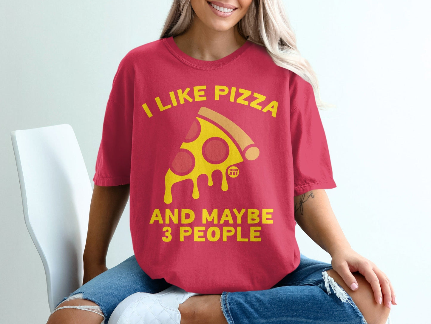 Red t-shirt with yellow text that says "I LIKE PIZZA AND MAYBE 3 PEOPLE" and a pizza slice graphic.