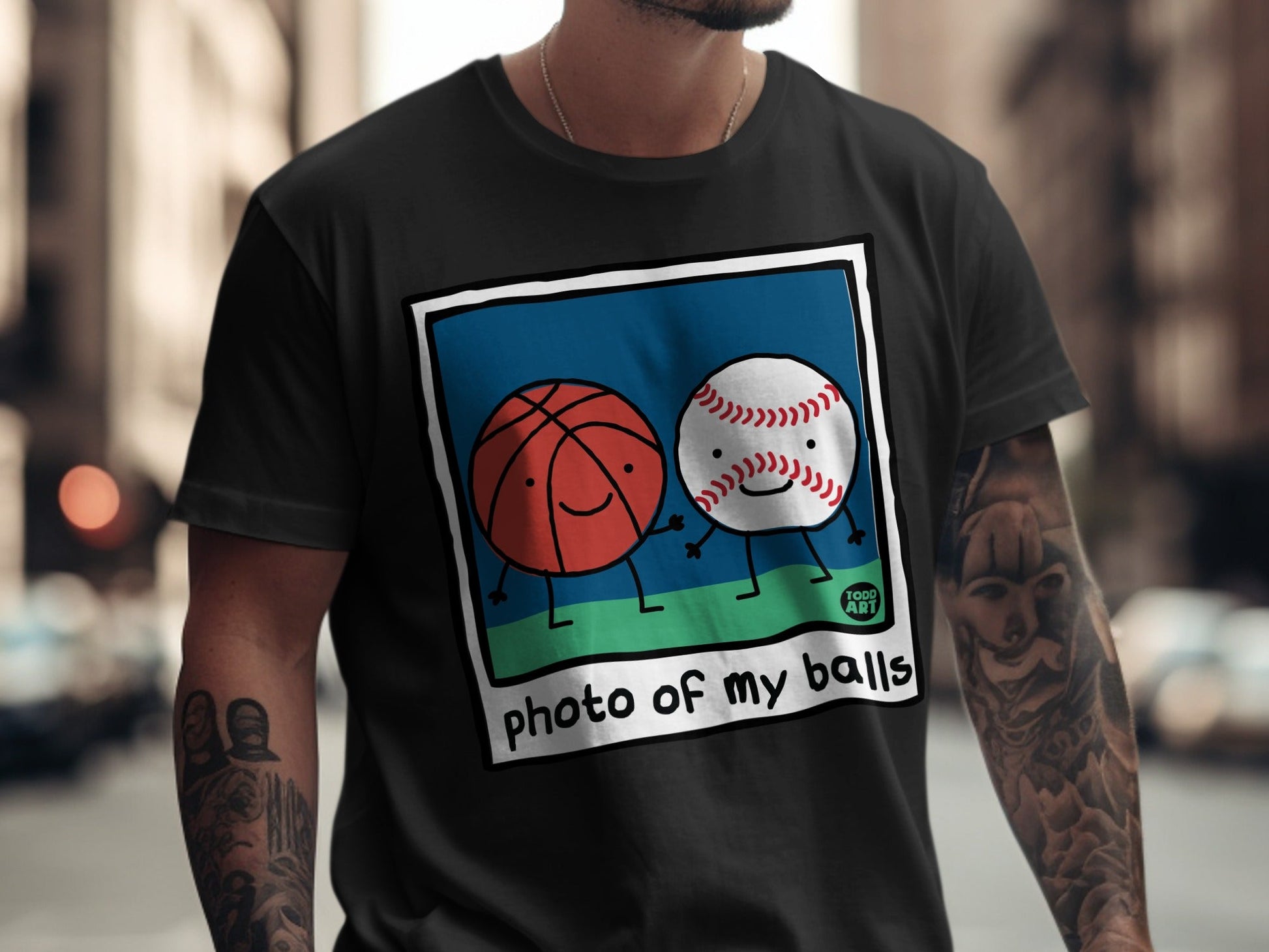 T-shirt featuring cartoon basketball and baseball with "photo of my balls" text.