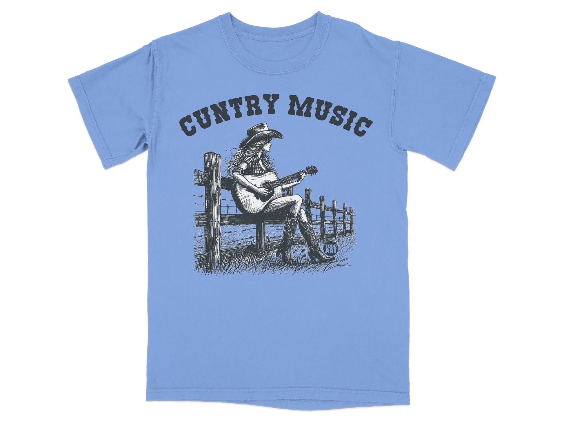 Blue t-shirt with "Country Music" text and illustration of a woman playing guitar.