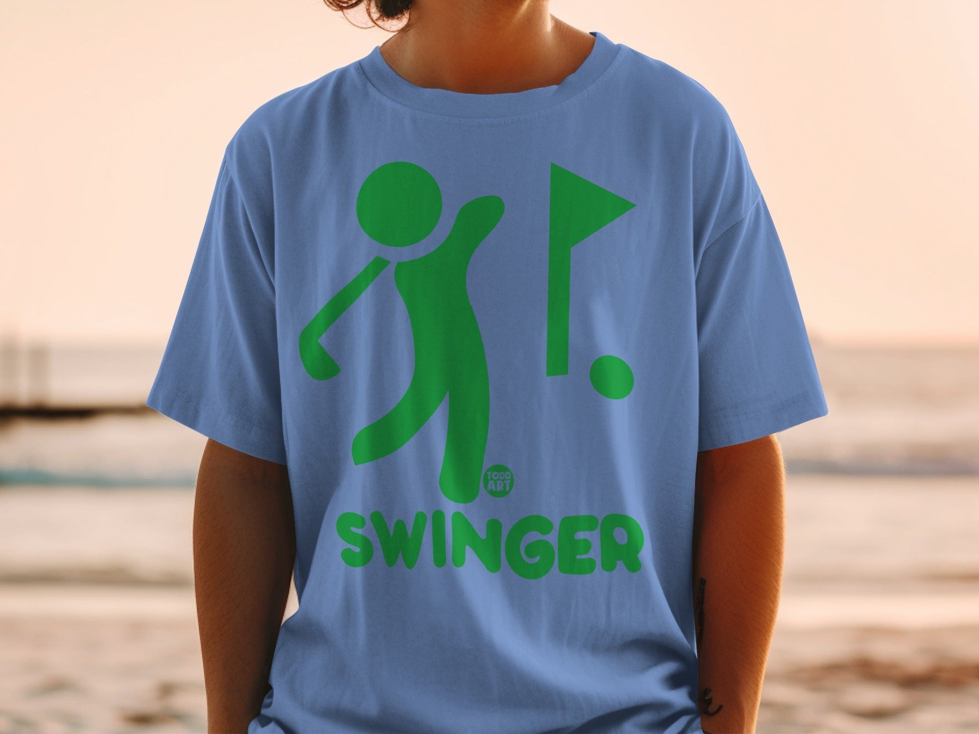 Blue t-shirt with green golf graphic and "SWINGER" text.
