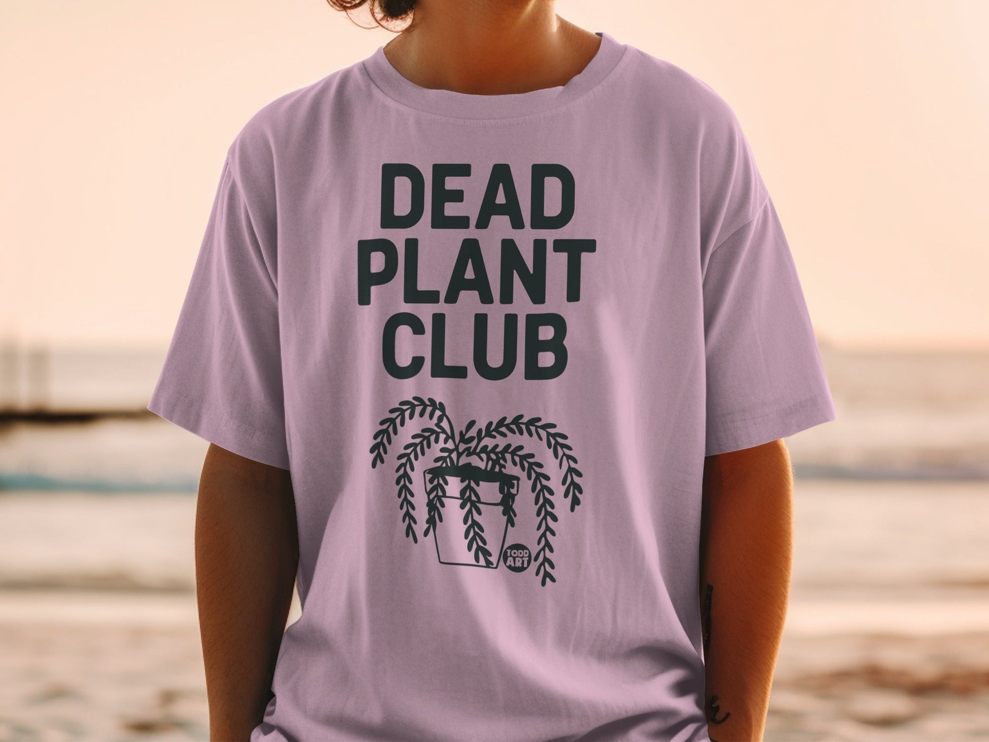 T-shirt with "DEAD PLANT CLUB" and a hanging plant illustration.