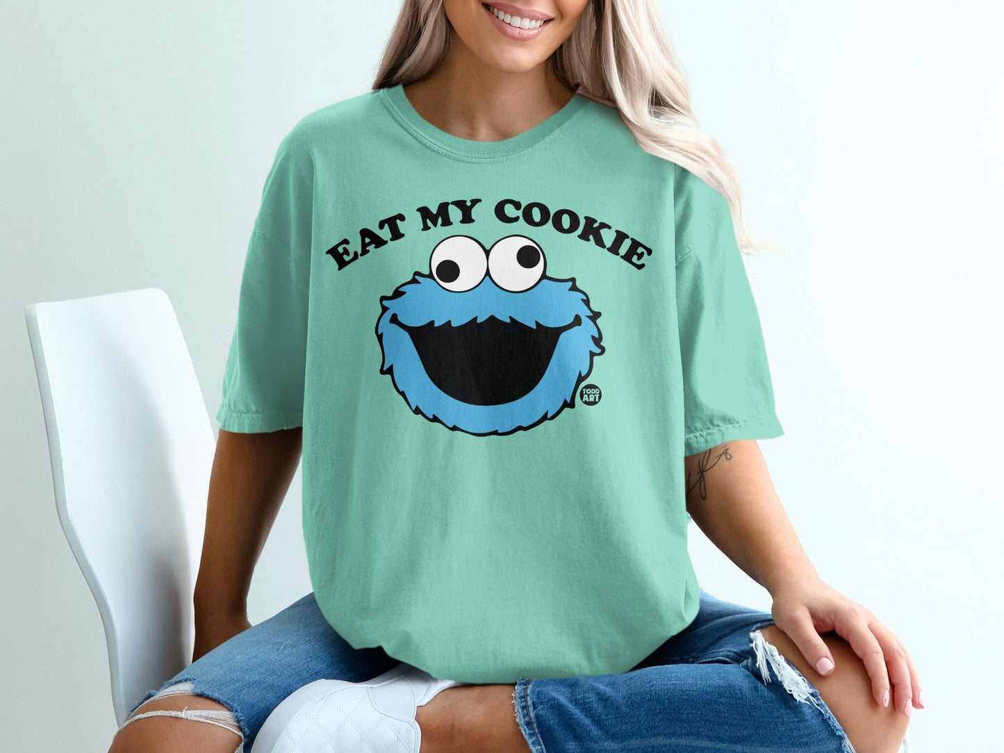 Teal t-shirt with Cookie Monster graphic and "Eat My Cookie" text.