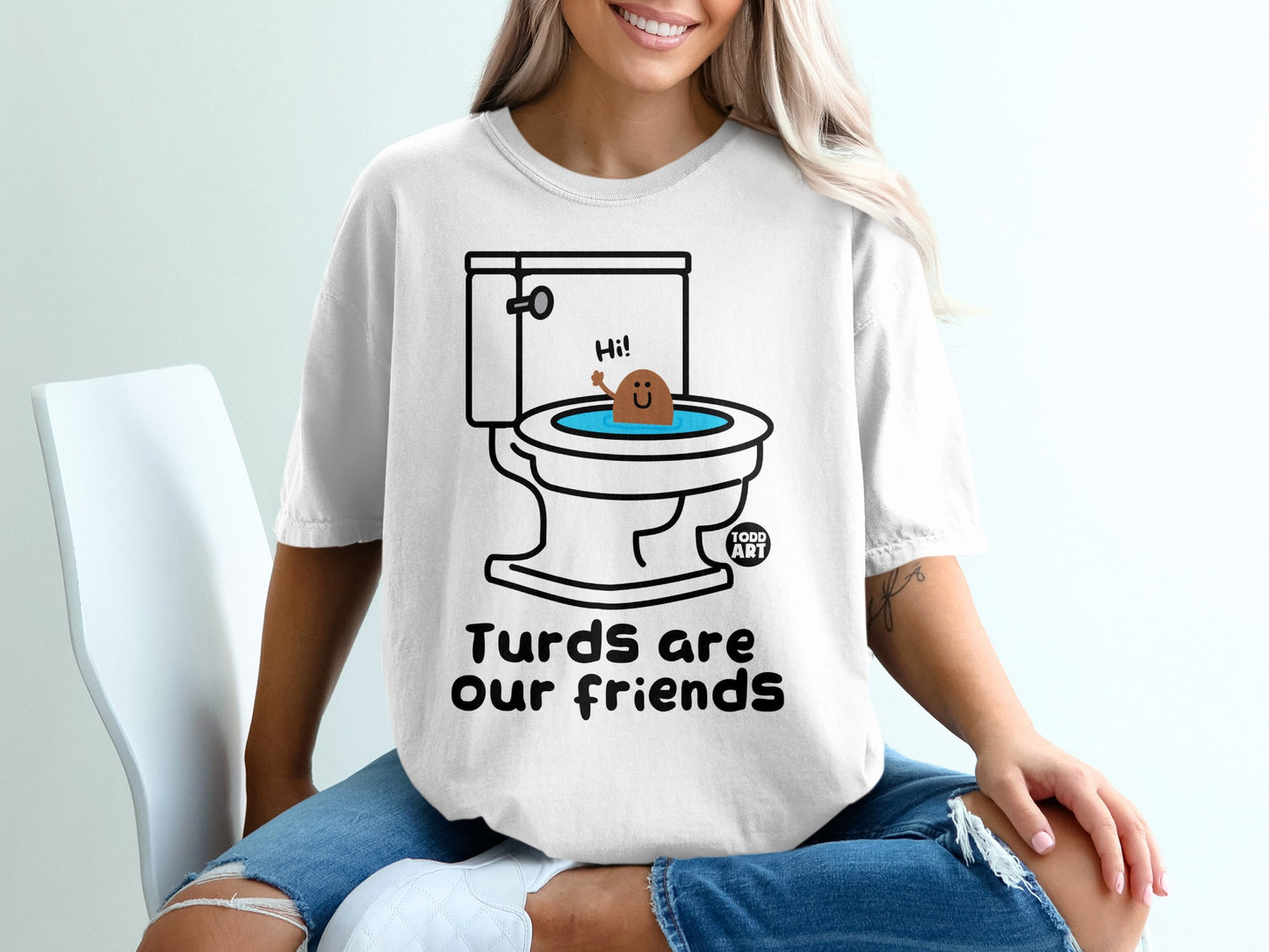T-shirt with a smiling turd in a toilet bowl and text "Turds are our friends."