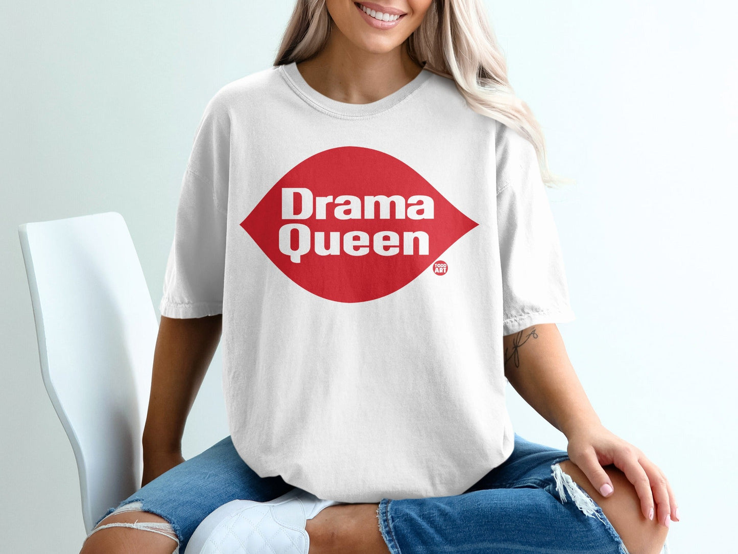 White t-shirt with "Drama Queen" text in a red diamond shape.