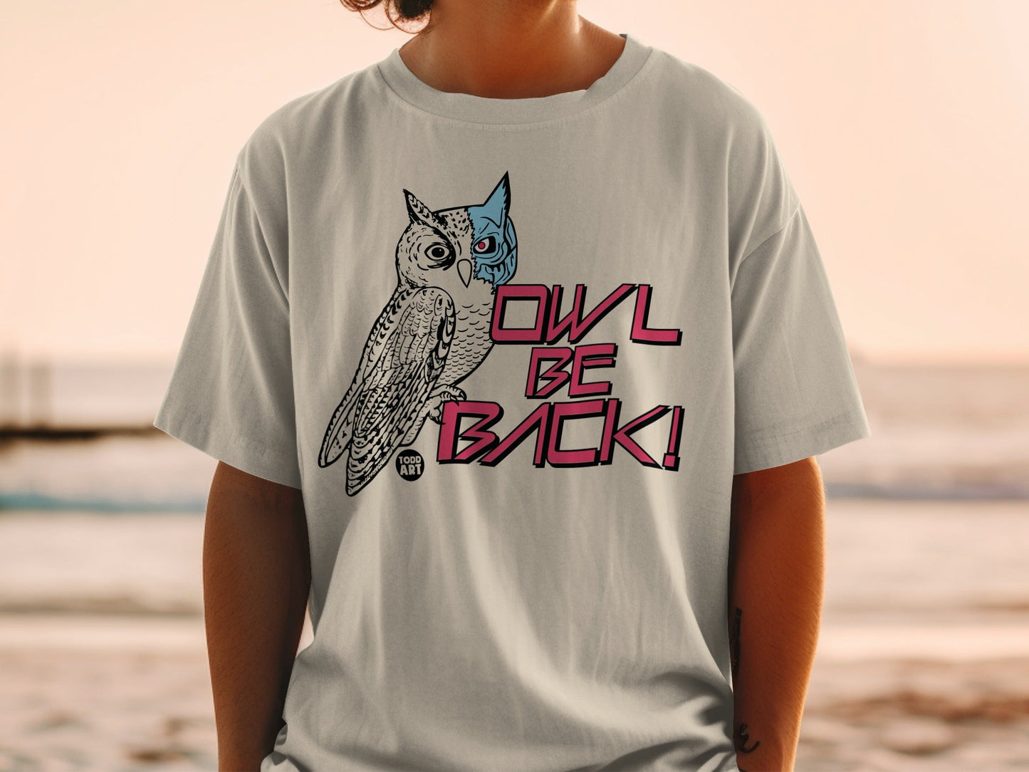 T-shirt with a stylized owl graphic and "OWL BE BACK!" text.