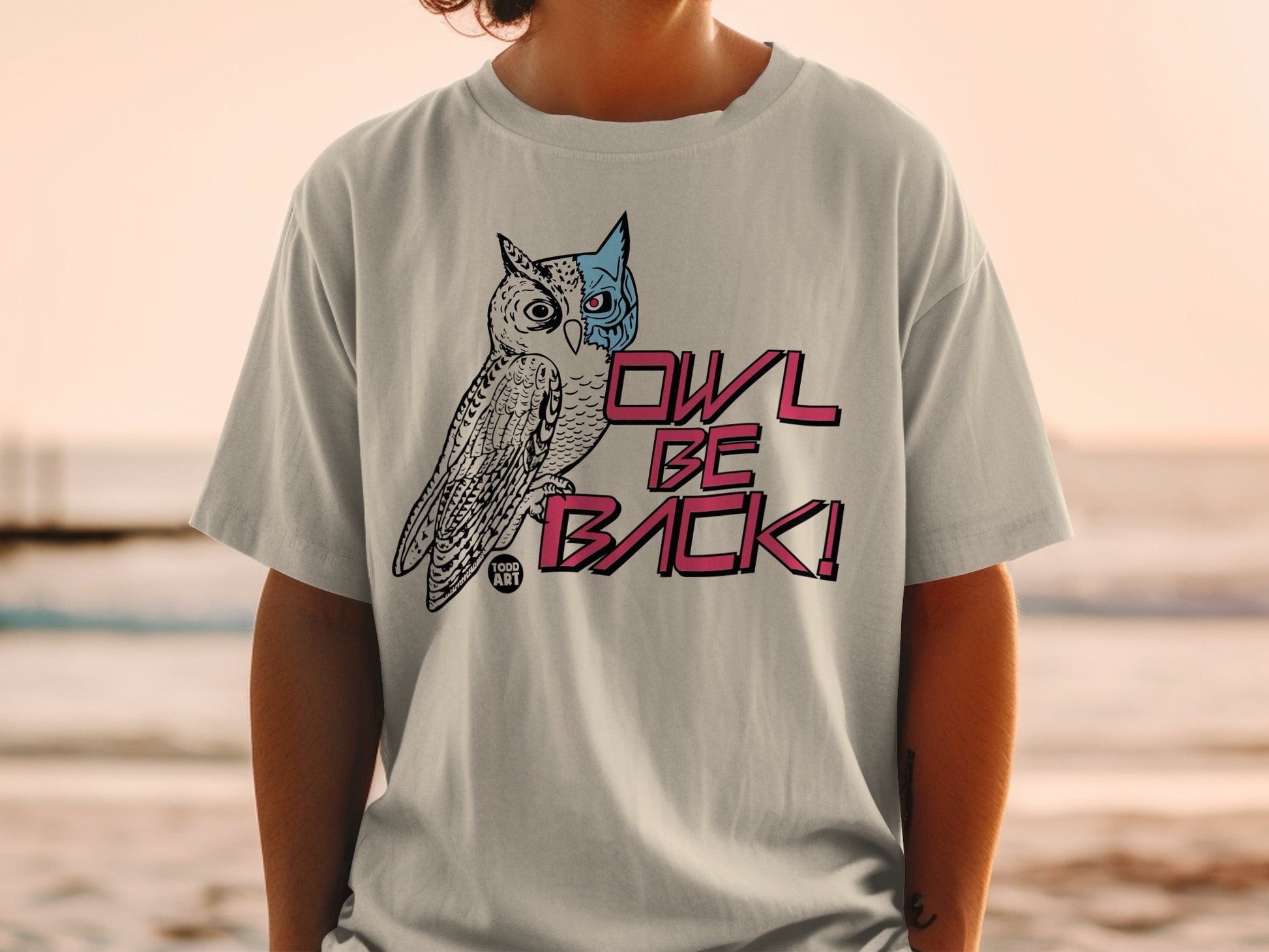 T-shirt with a stylized owl graphic and "OWL BE BACK!" text.