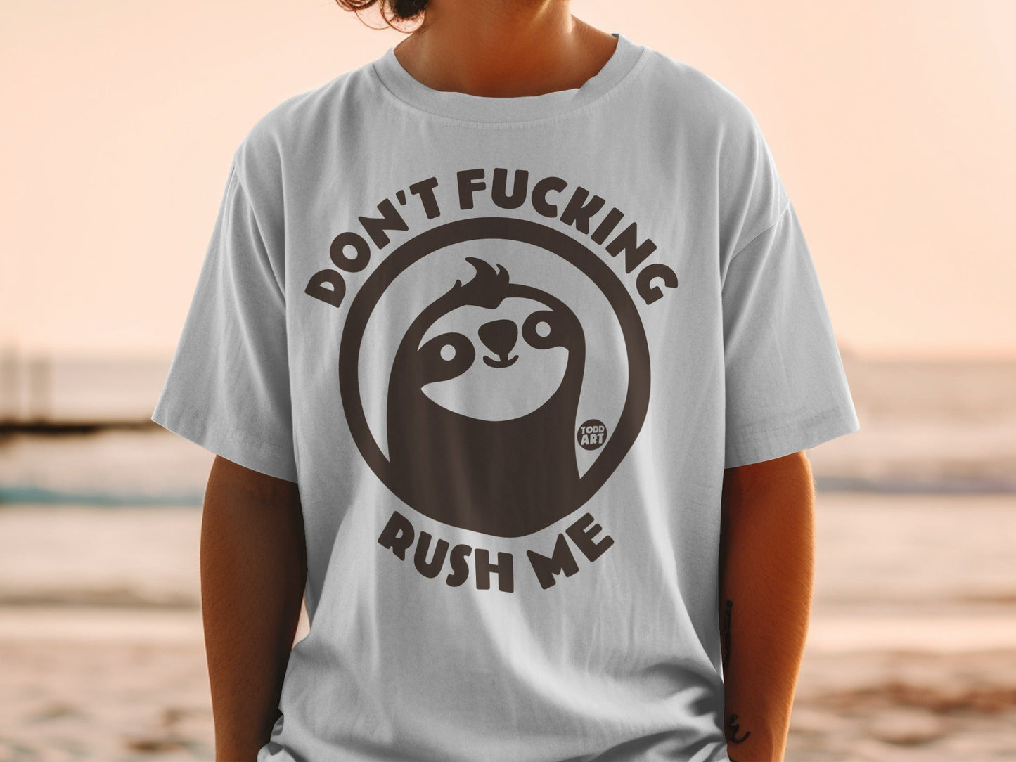 Grey t-shirt with a sloth wearing glasses and text that says "Don't Fucking Rush Me".
