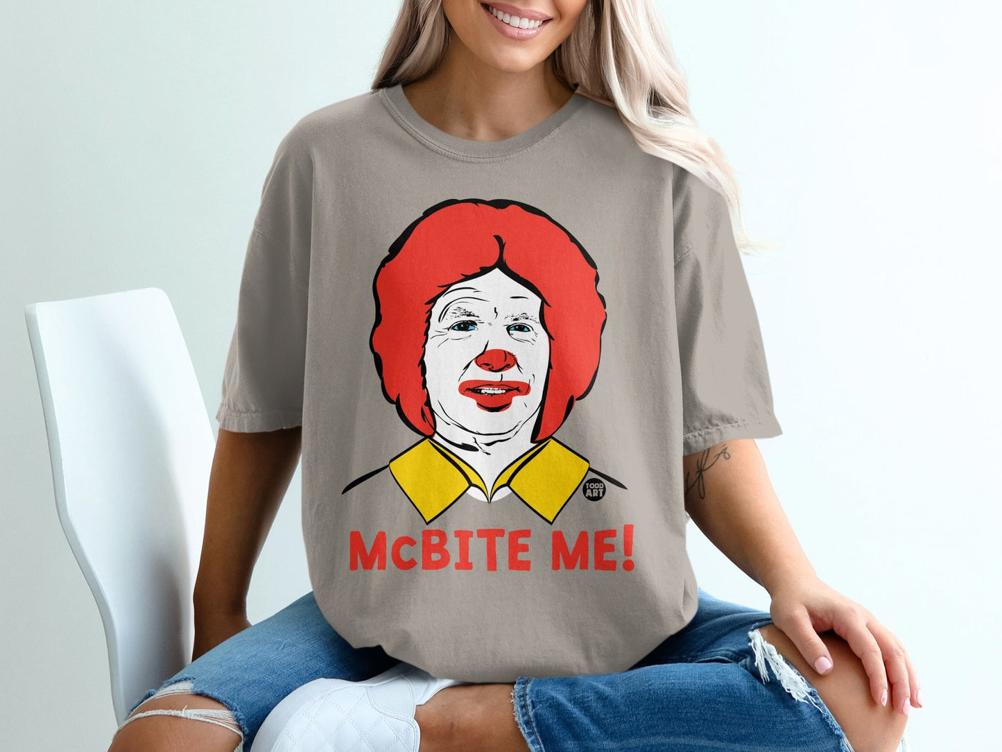 T-shirt with Ronald McDonald portrait and "MCBITE ME!" text.
