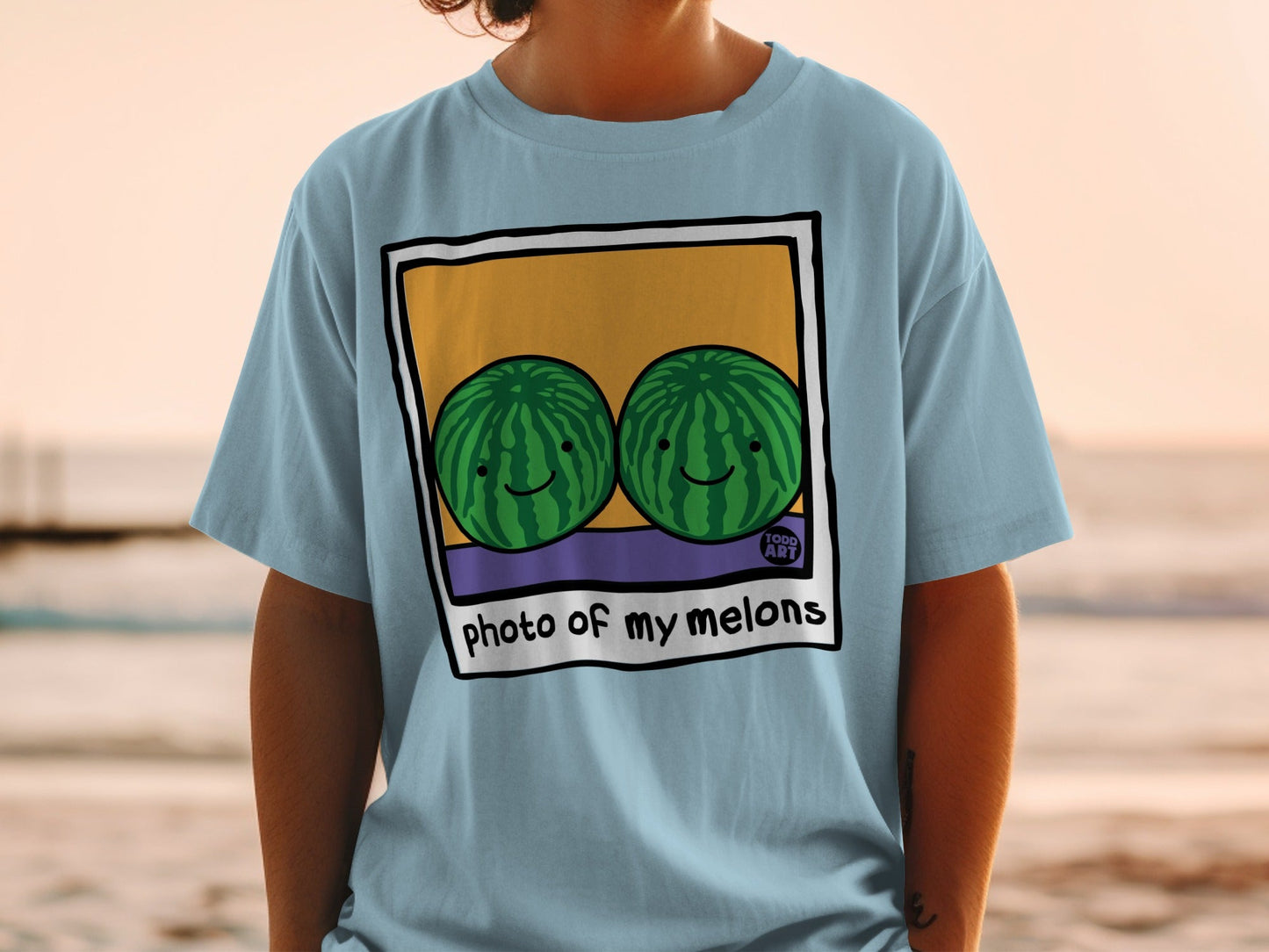 Light blue t-shirt with "photo of my melons" graphic featuring two cartoon watermelons.