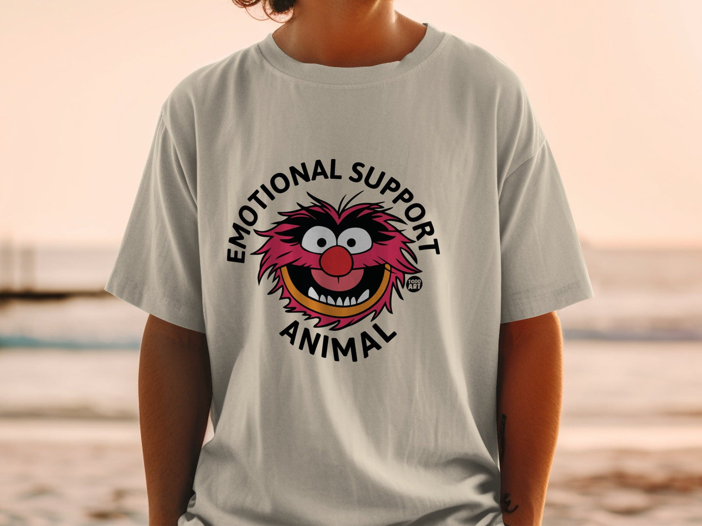 Graphic tee with "Emotional Support Animal" text and cartoon character.
