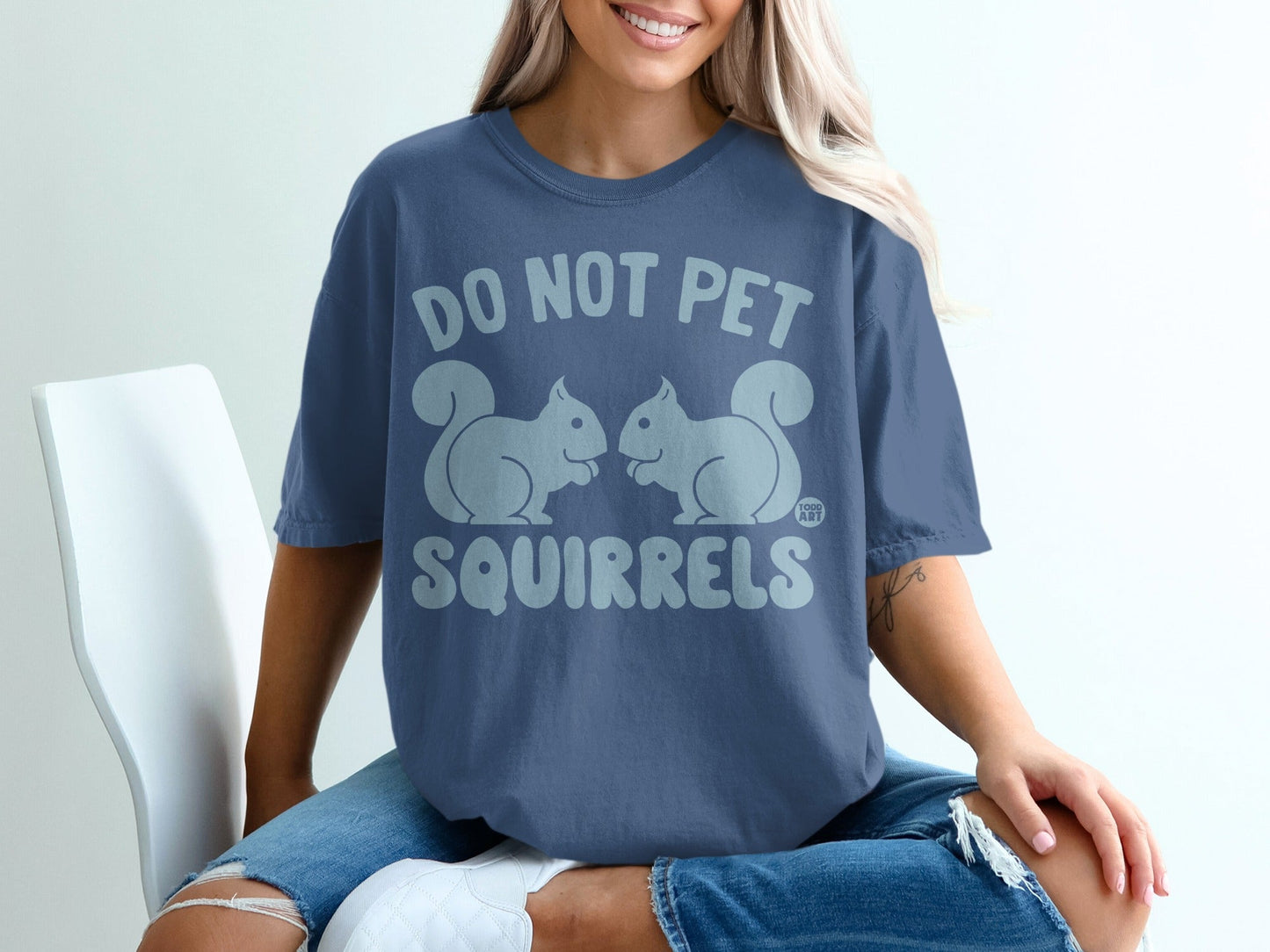 Blue t-shirt with "DO NOT PET SQUIRRELS" and two squirrels graphic.