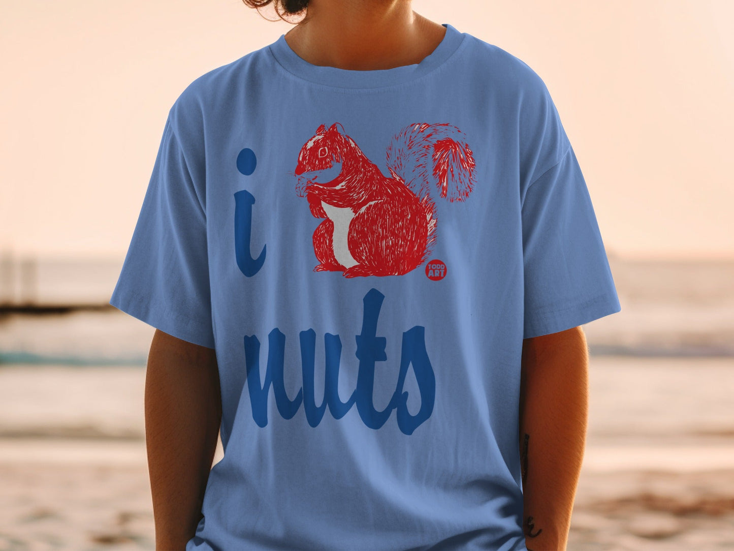 Blue t-shirt with red graphic of a squirrel and "i nuts" text.