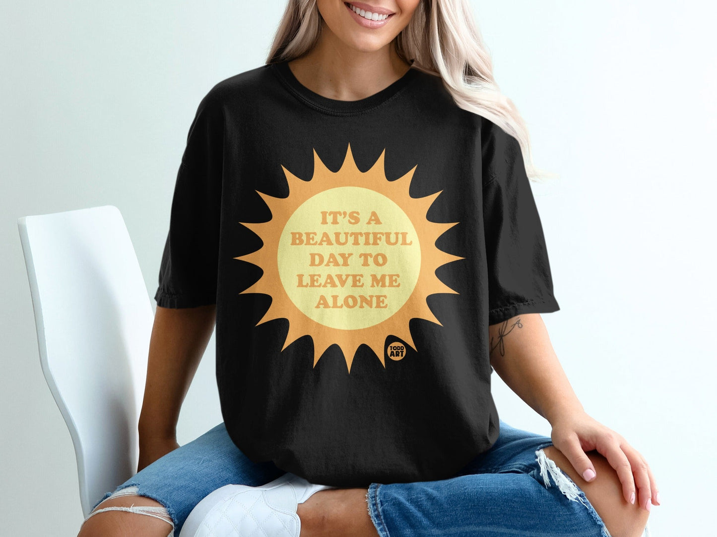Black t-shirt with sun graphic and text "It's a beautiful day to leave me alone."