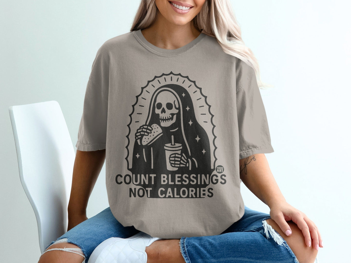 Grim reaper wearing sunglasses eating a taco and holding a drink, text "COUNT BLESSINGS NOT CALORIES".