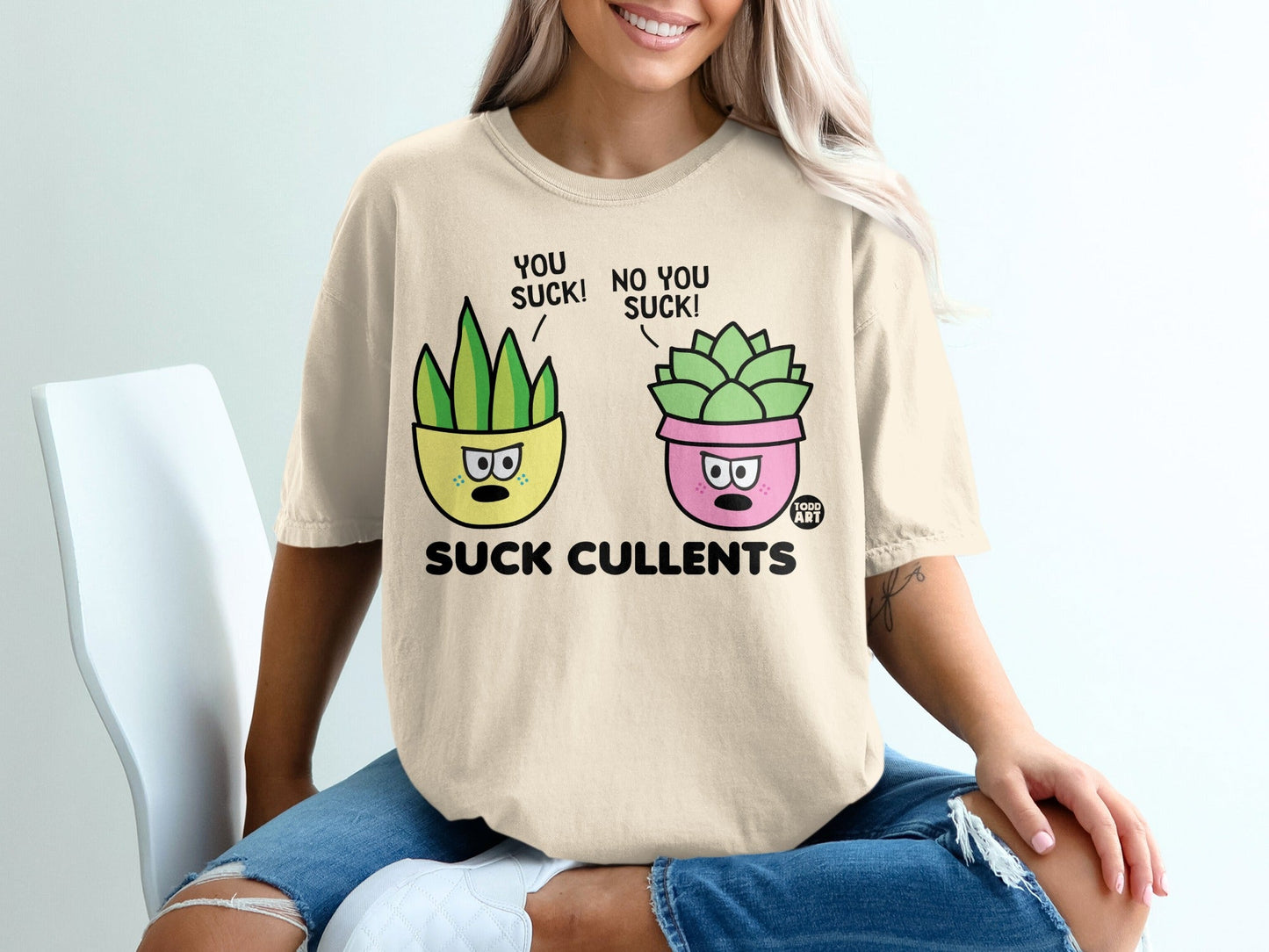 T-shirt with cartoon succulents saying "You suck!" and "No you suck!".