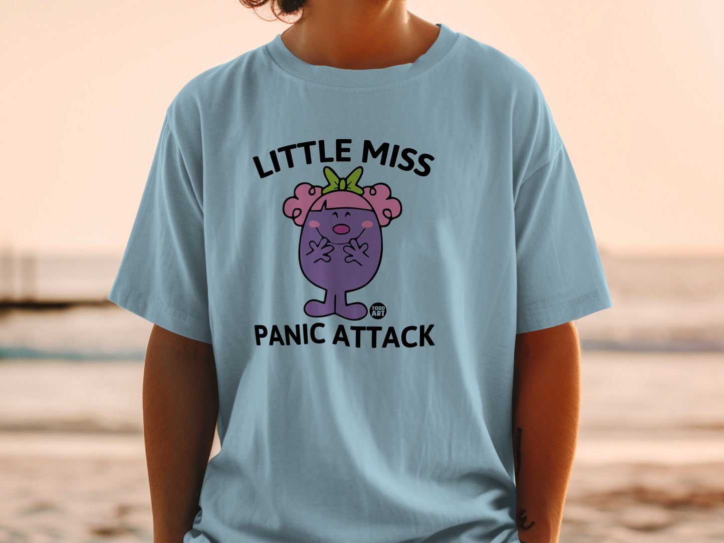 Light blue t-shirt with Little Miss Panic Attack graphic and text.