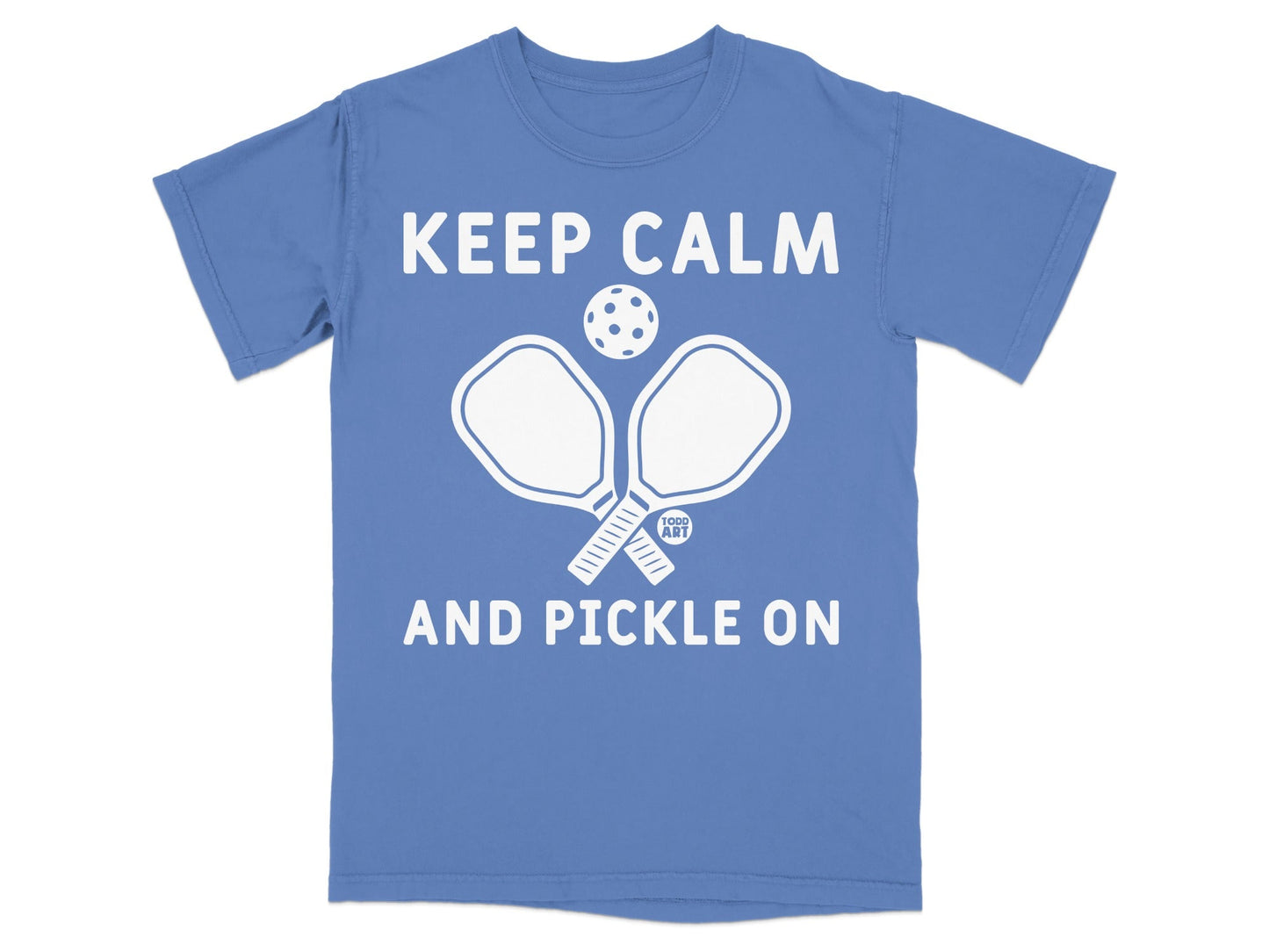 Blue t-shirt with "Keep Calm and Pickle On" and pickleball paddles.