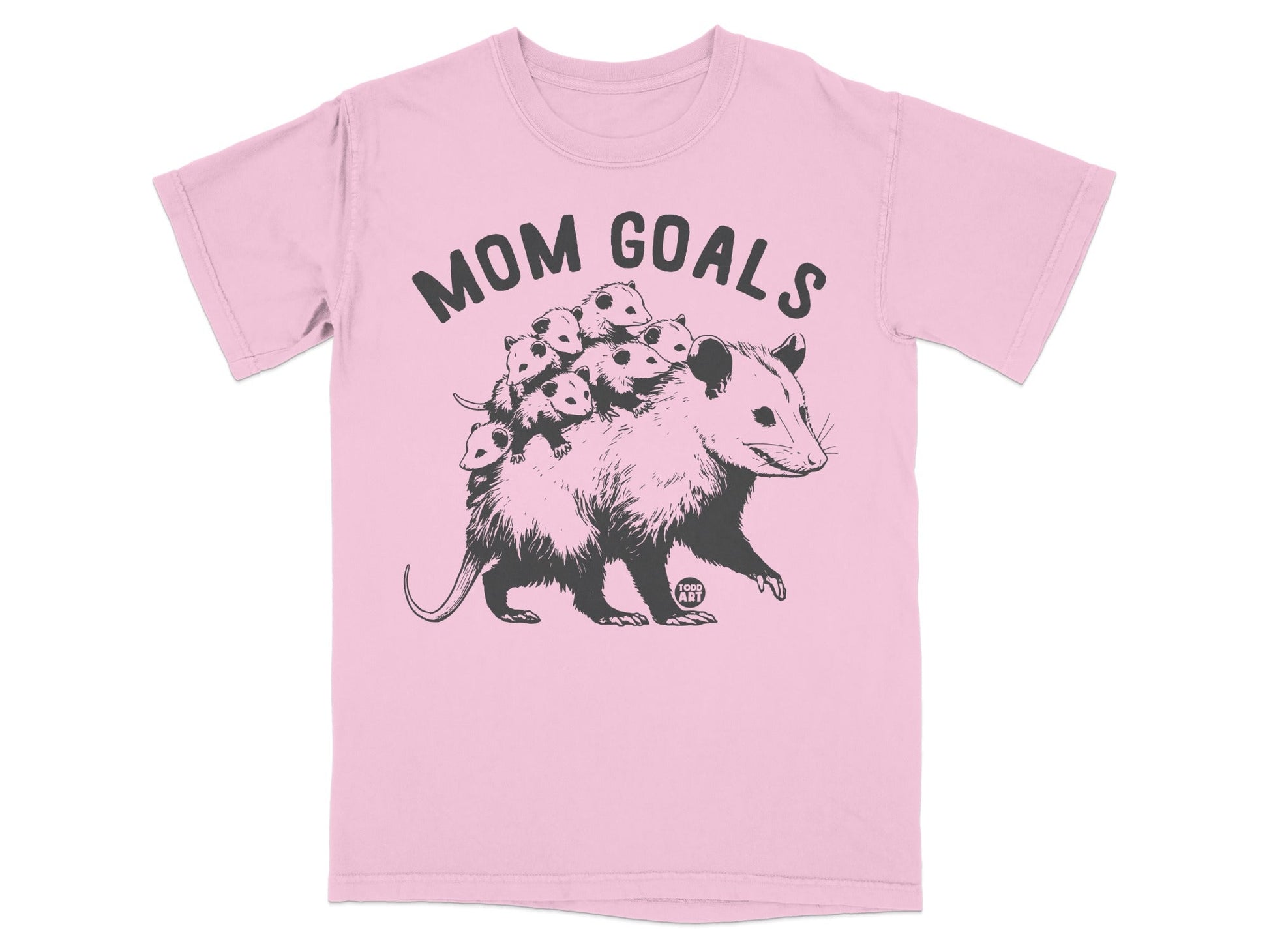 Opossum family with "MOM GOALS" text on pink t-shirt.