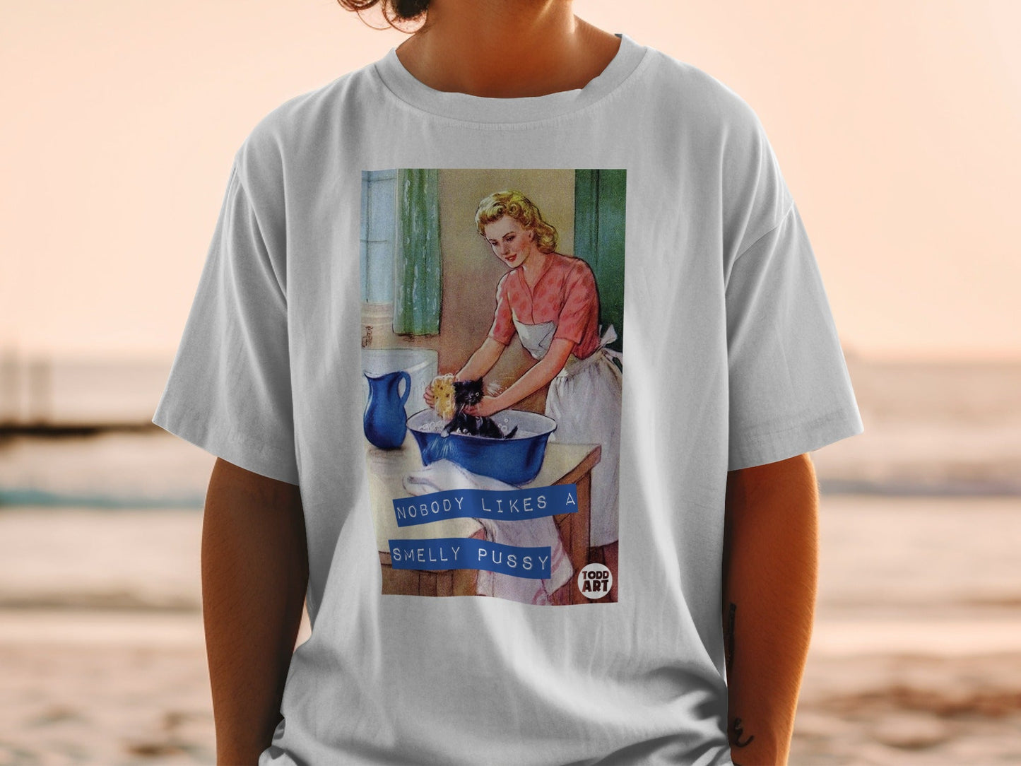Woman washing a cat with text "NOBODY LIKES A SMELLY PUSSY".
