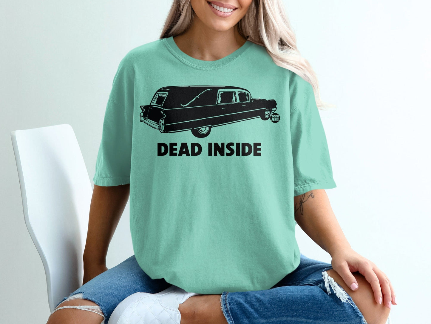 Mint t-shirt with a hearse graphic and "DEAD INSIDE" text.
